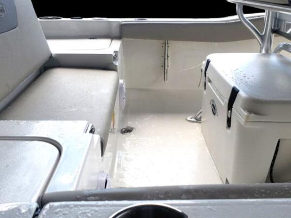 2025 Key West 179 FS boat interior with seating and storage.