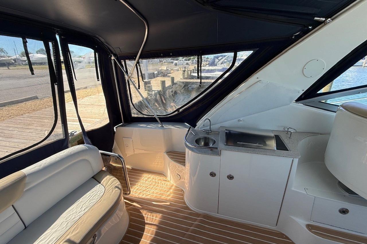Interior of 2008 Sea Ray Sundancer 330 yacht with seating and kitchenette.