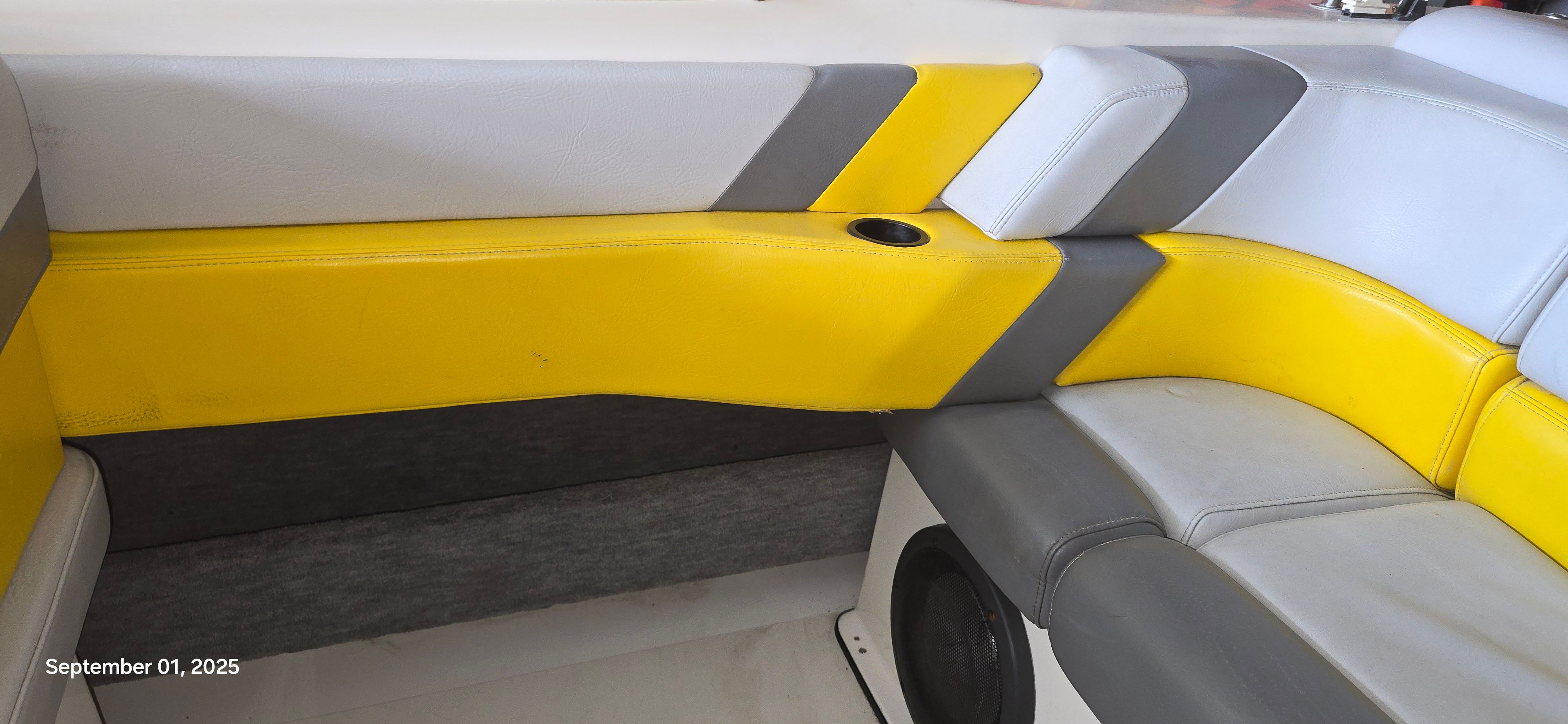 Interior of a 1989 Baja FORCE 235 with yellow and gray upholstery.