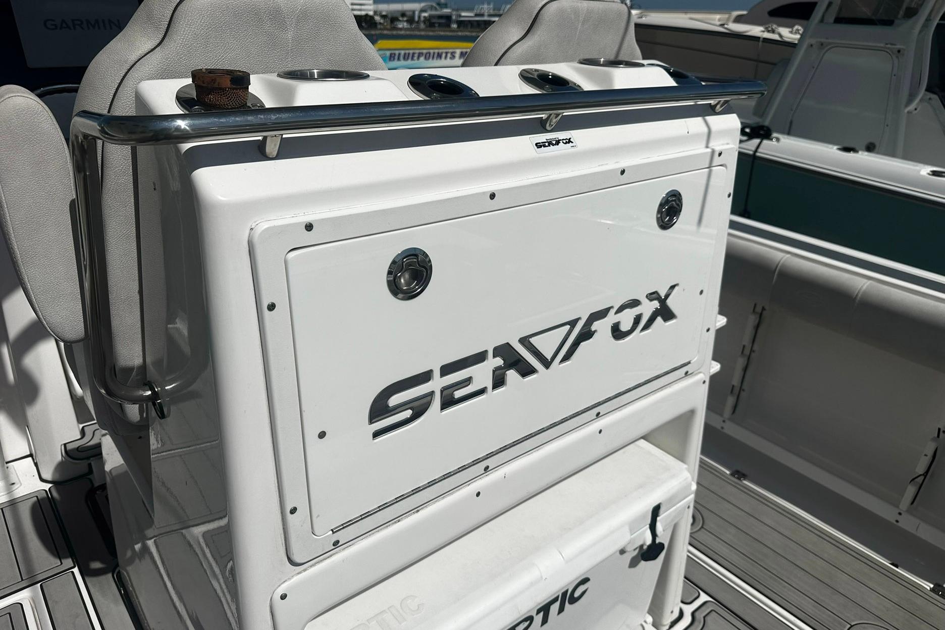 Sea Fox 228 Commander boat interior, featuring seating and storage, 2002 model.
