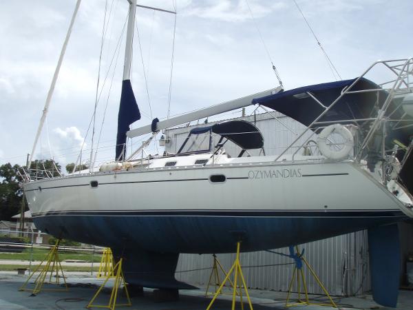 Sailboat Jeanneau 45.2, 2001 model, on stands in a boatyard.