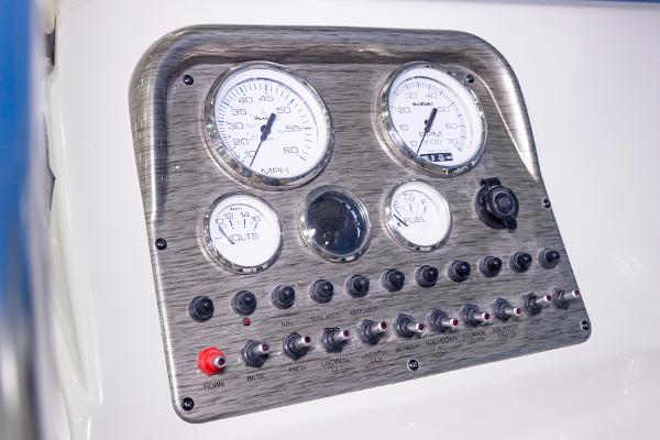 Manufacturer Provided Image: Dashboard of 2026 Carolina Skiff 23 LS with gauges and switches.