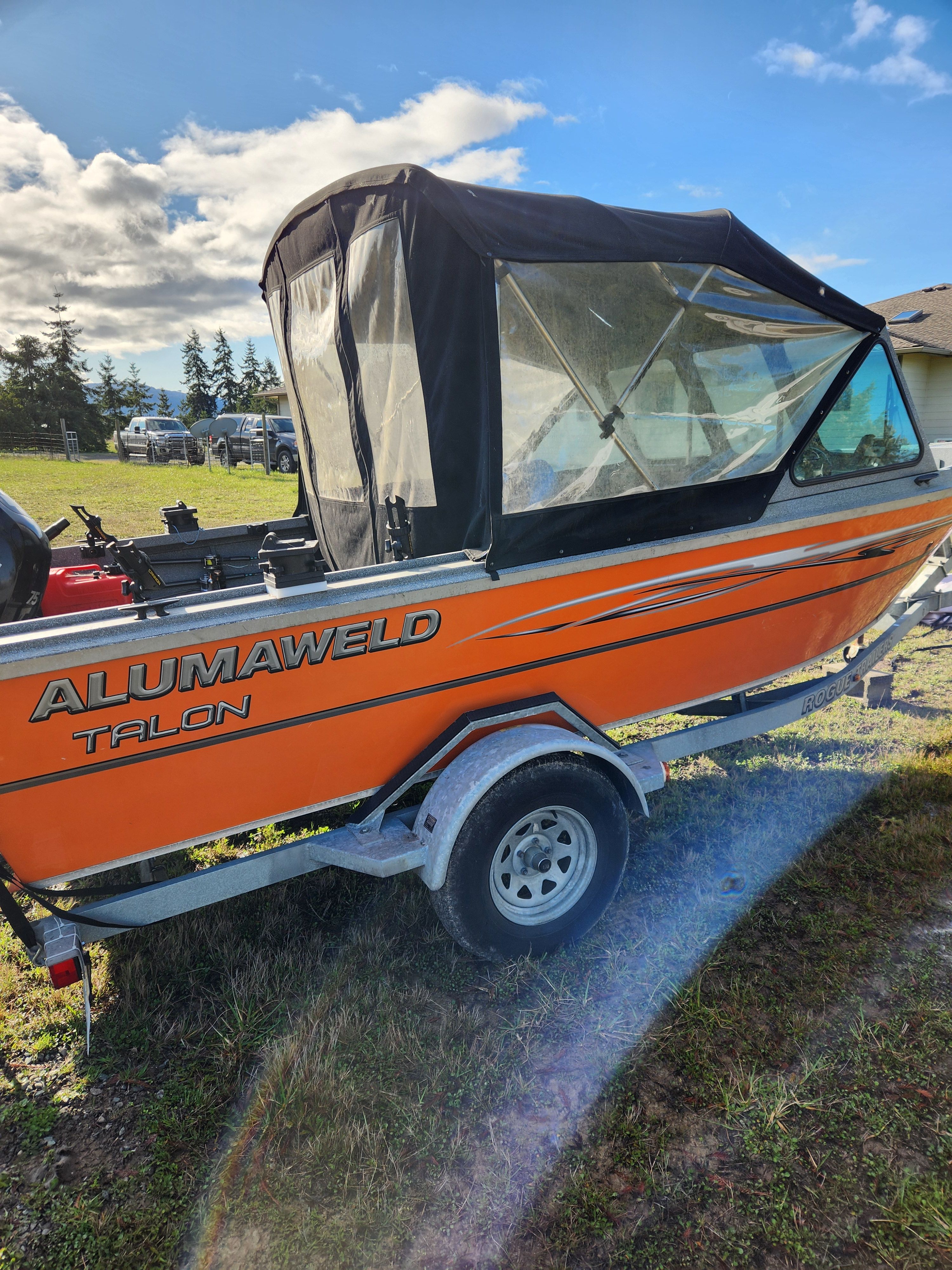 2020 Alumaweld Talon 18 boat with black canopy on trailer.