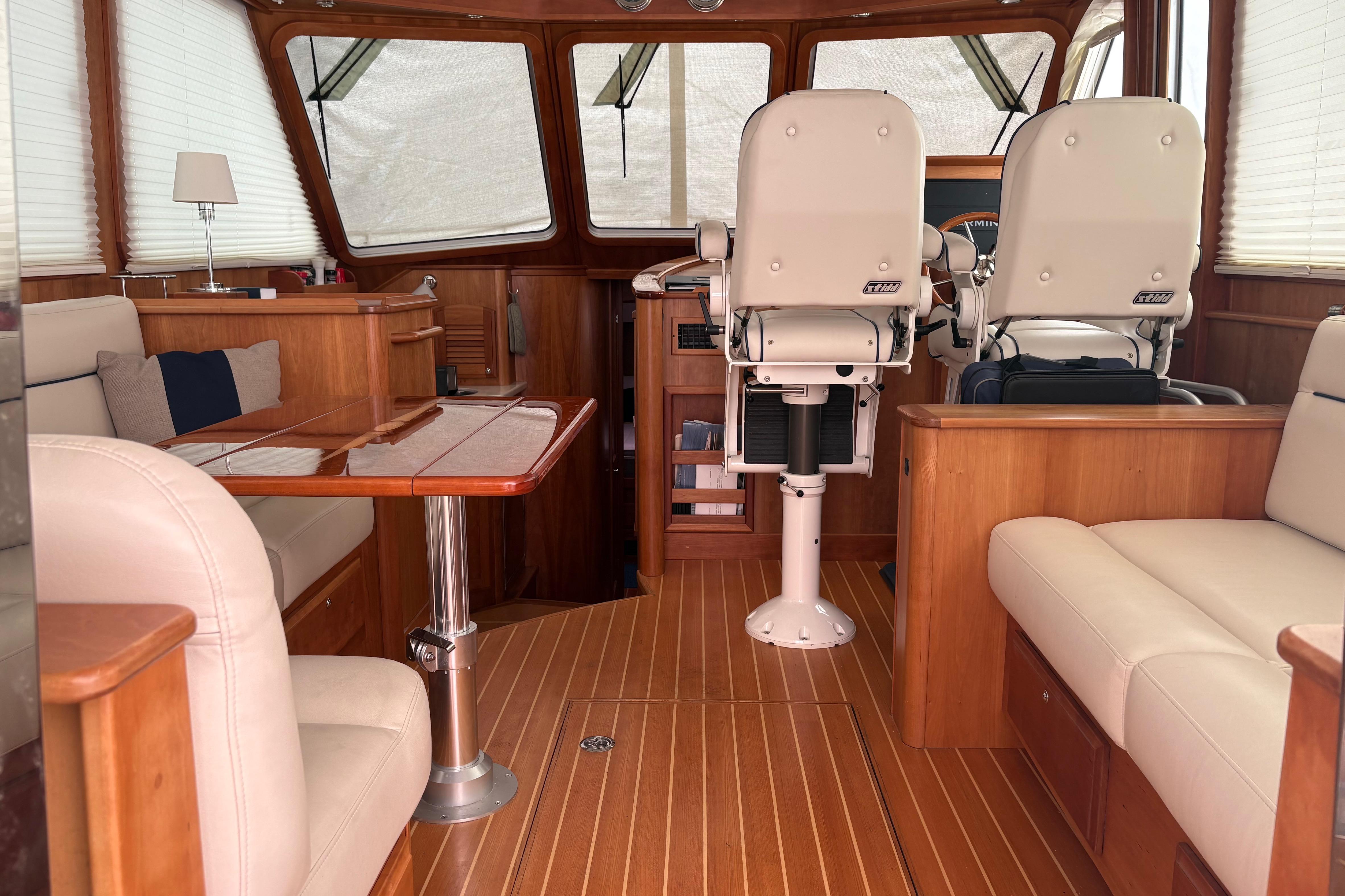 Interior of 2020 Sabre 42 Salon Express yacht with elegant wood finish and seating.