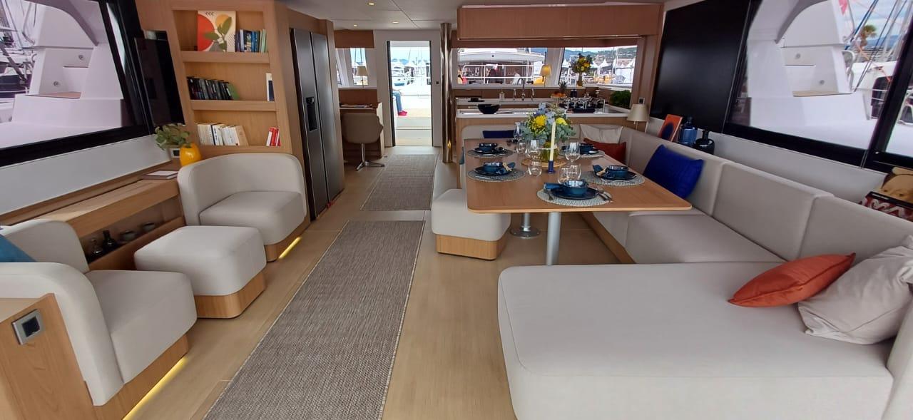 Luxurious interior of 2025 Bali 5.8 yacht with elegant seating and dining area.