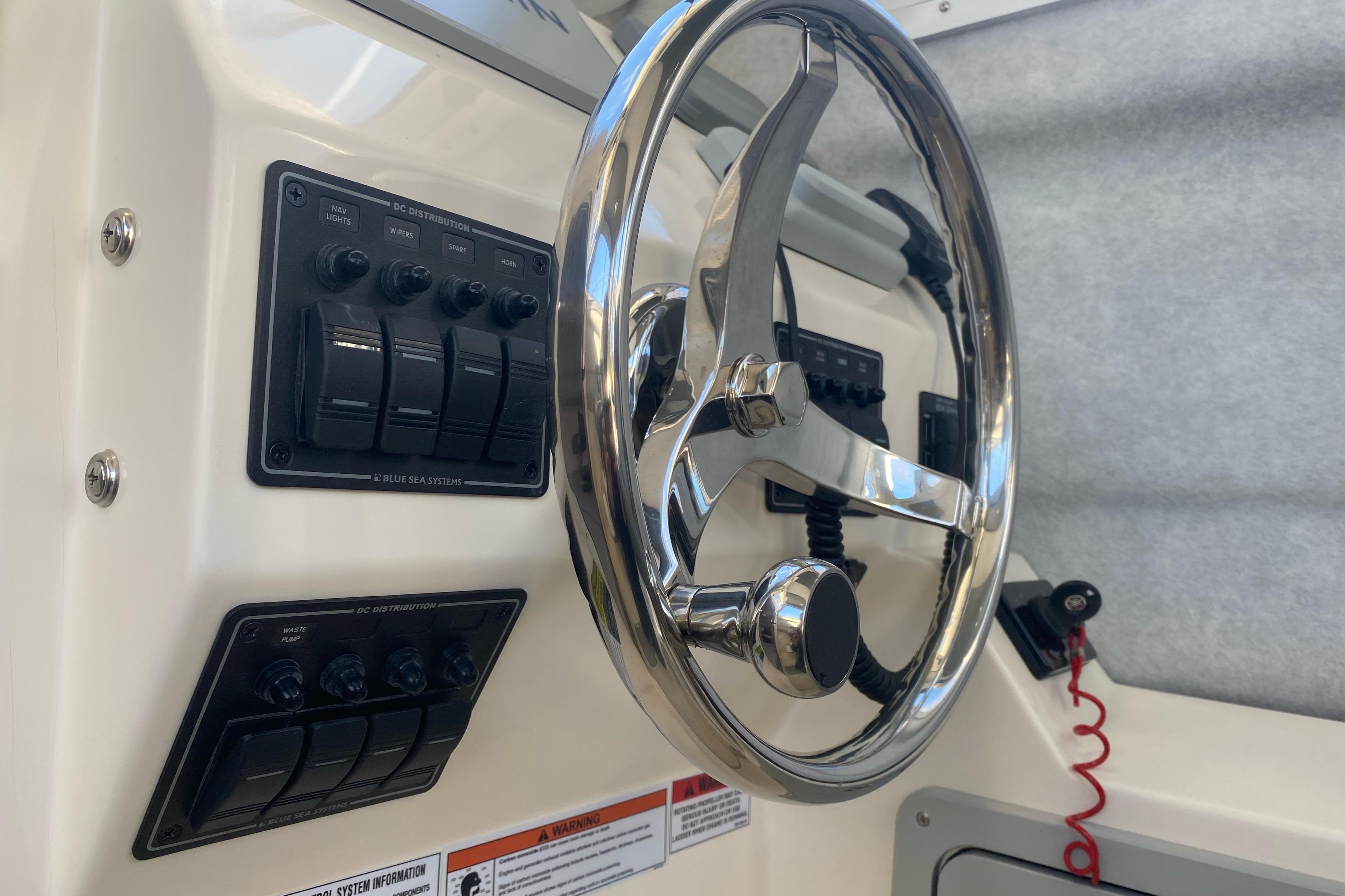 2023 Defiance Admiral 250 EX boat steering wheel and control panel.