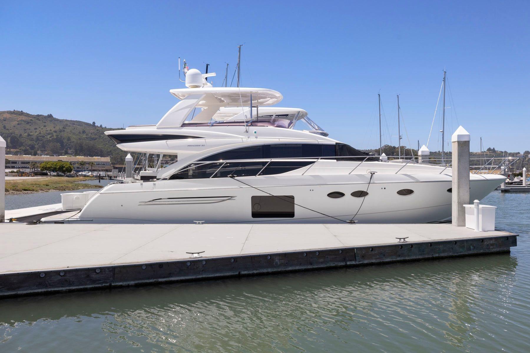 2015 Princess 60 Flybridge Motor Yacht docked at marina, side view.