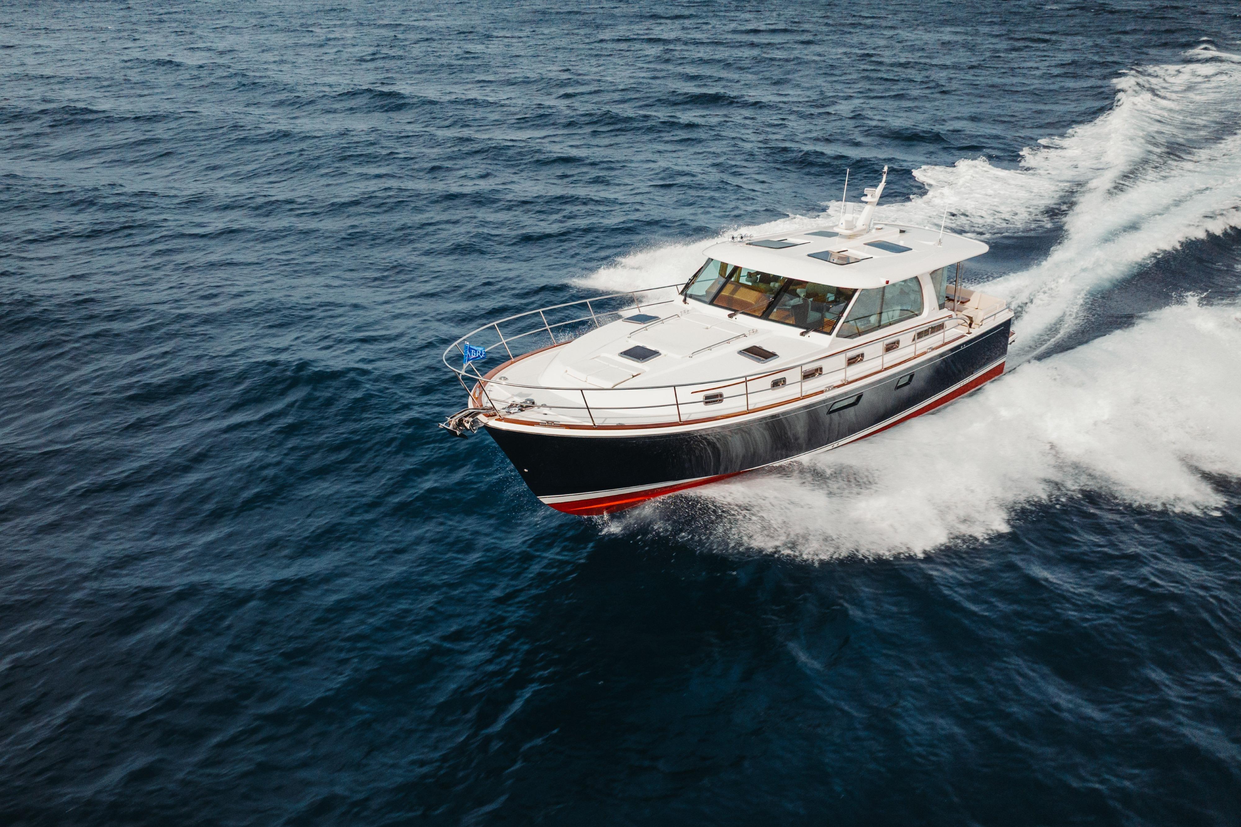 2026 Sabre 51 Salon Express cruising on open water, showcasing sleek design and performance.
