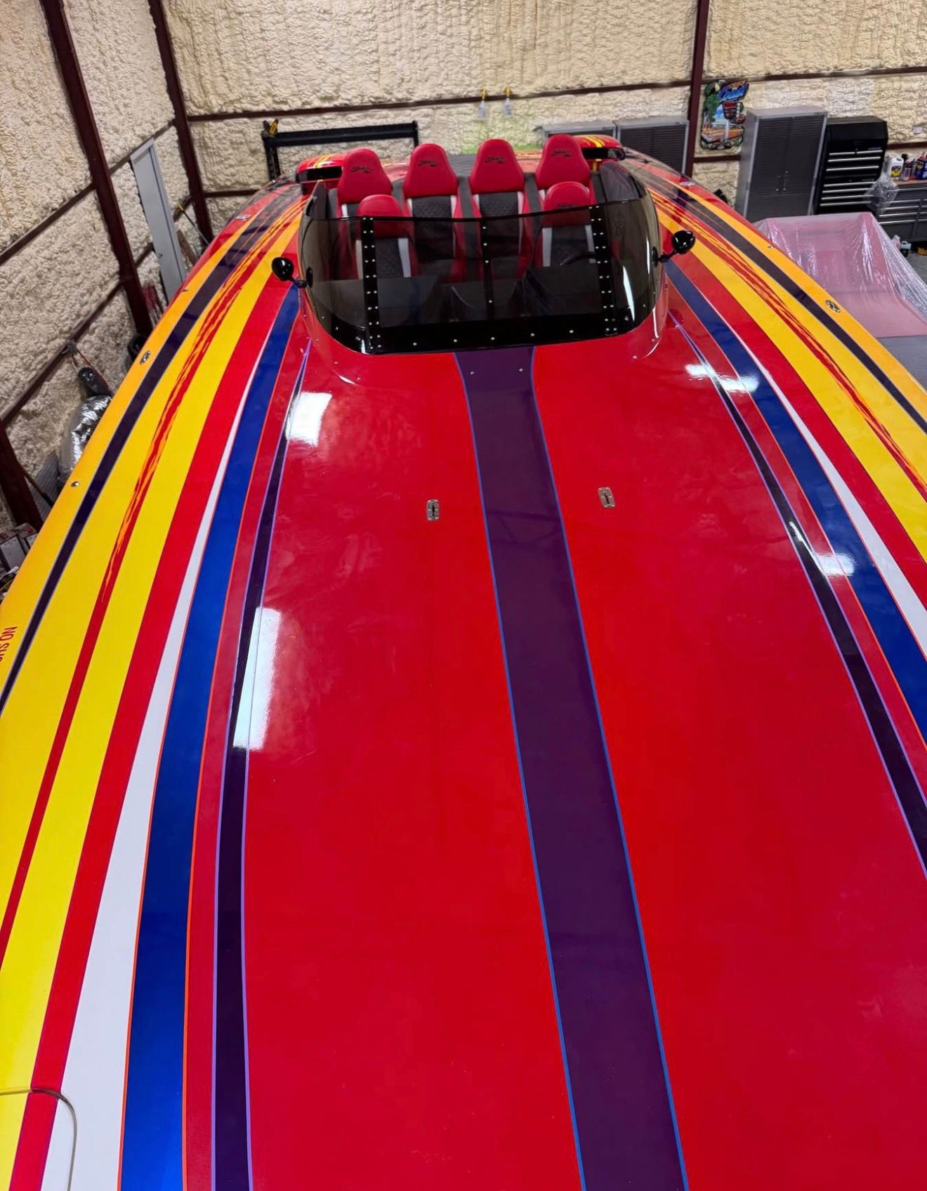 Colorful Skater 40 S.S. boat from 2003 in warehouse.