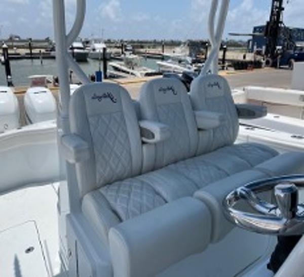 2022 Yellowfin 39 Offshore boat with luxurious seating at a marina.