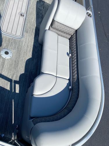 2024 Ranger Reata 223C boat interior with gray cushioned seating.
