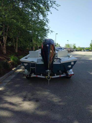 2024 Ranger RB210 boat on trailer in parking lot.