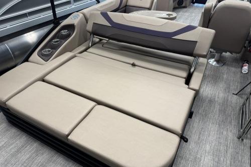 2026 Bennington 22SXSB boat interior with beige seating and cup holders.