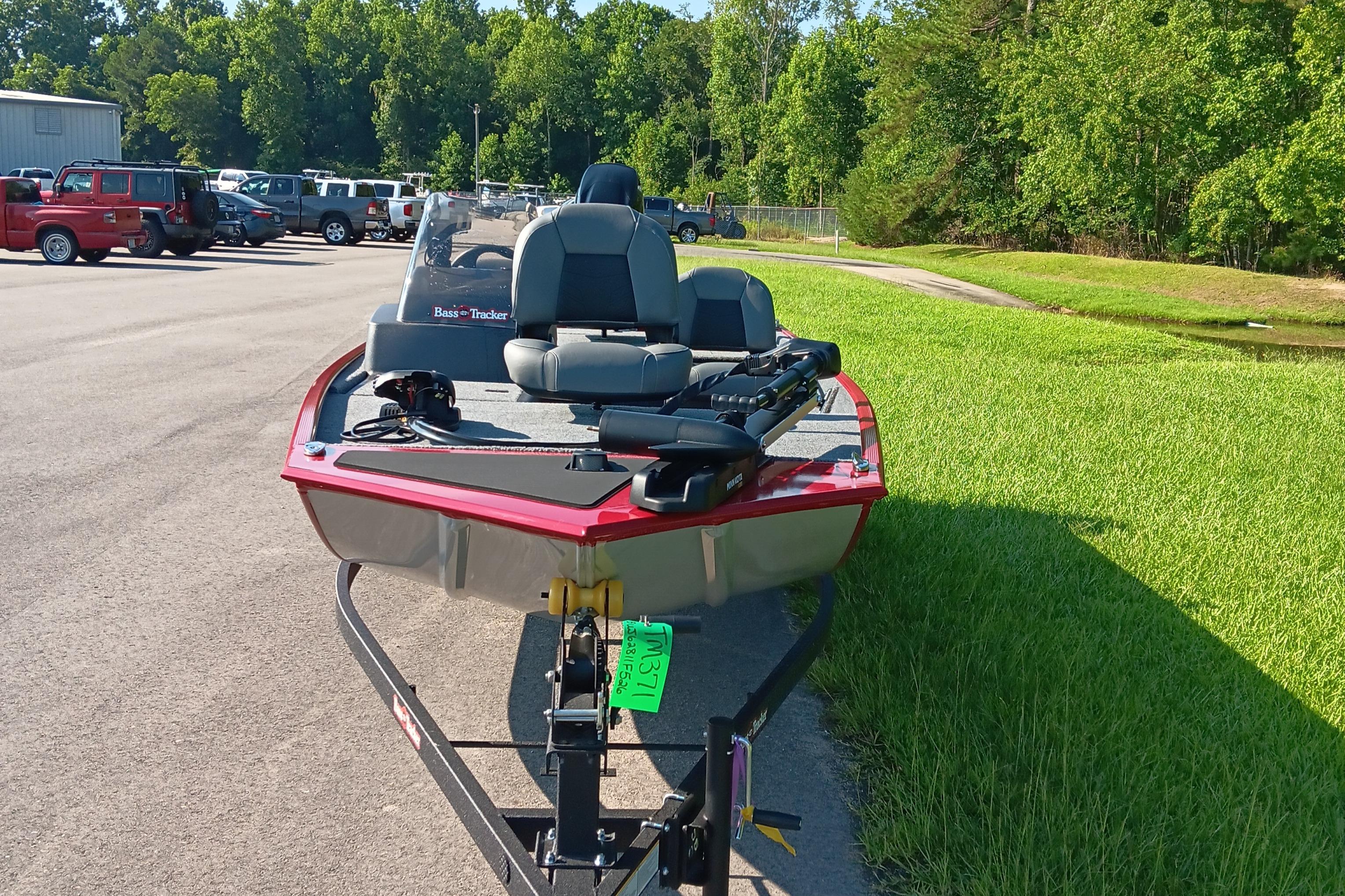 2026 Tracker Bass Tracker Classic XL boat on trailer in parking lot.