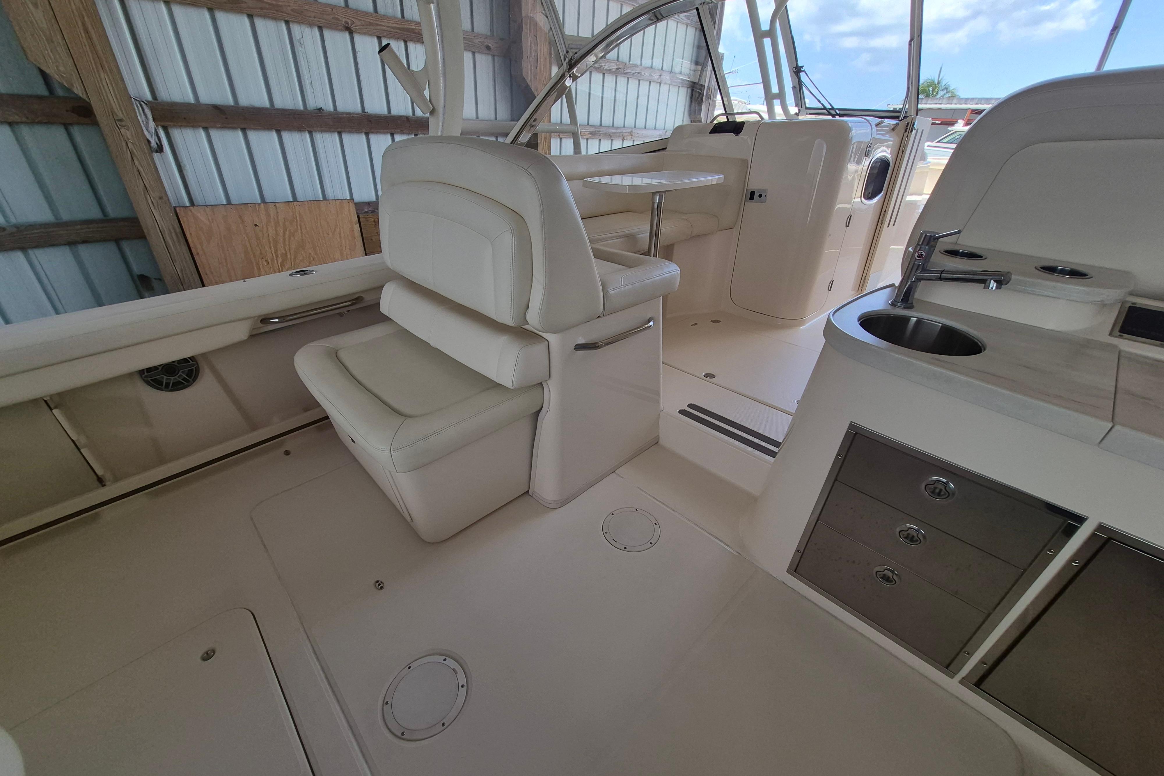 2019 Grady-White Freedom 335 boat interior with seating and kitchenette.