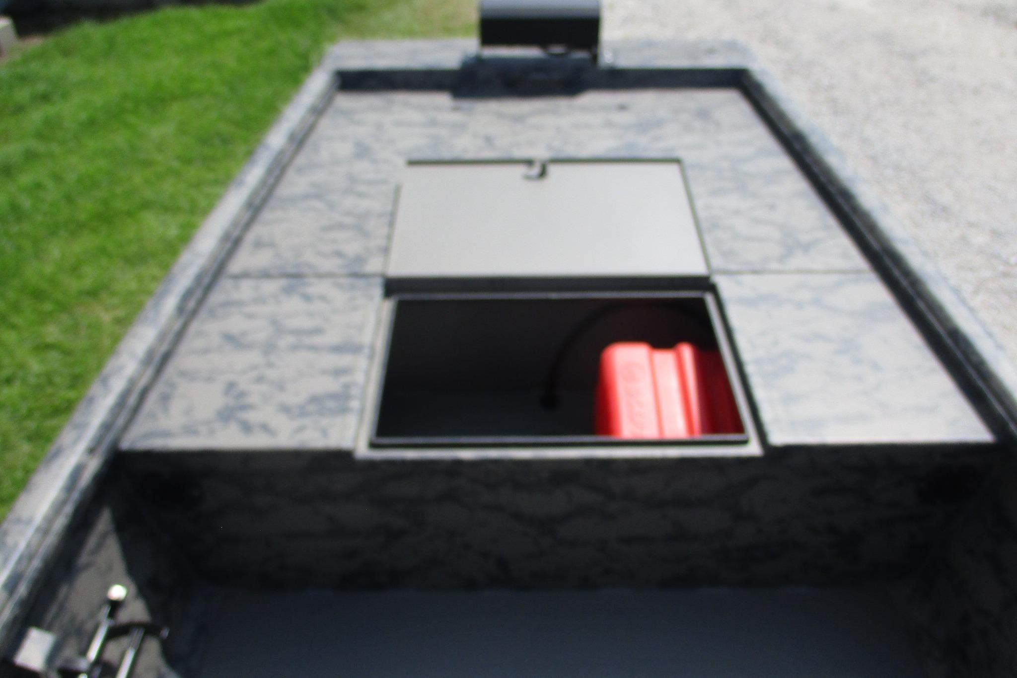 2026 Gator Tail 1754 Extreme boat with open storage compartment and red fuel tank.