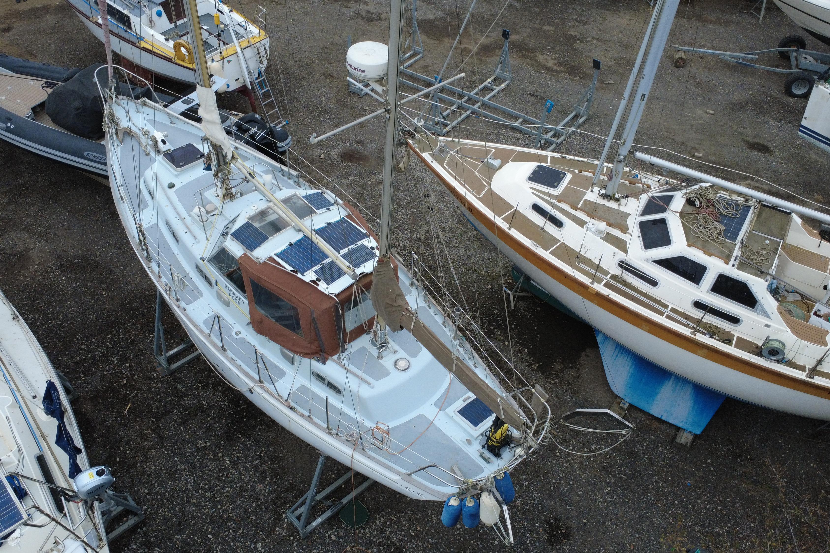 Aerial view of a 1972 Barbary Ketch sailboat in a boatyard.