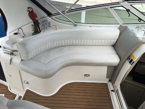 Interior of a 2004 Cruisers Yachts 3372 Express with white seating area.
