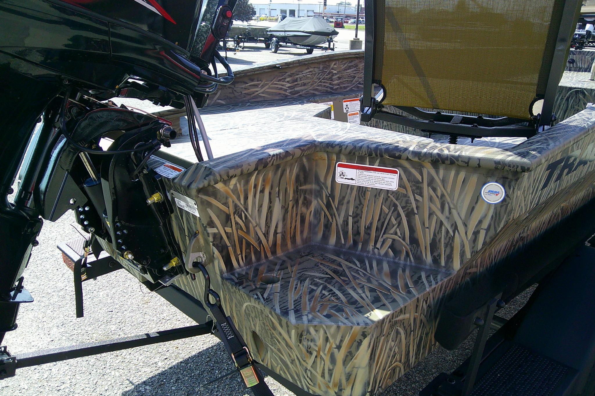 2026 Tracker Grizzly 1650 T Prairie Wings Edition boat with camouflage design and motor.