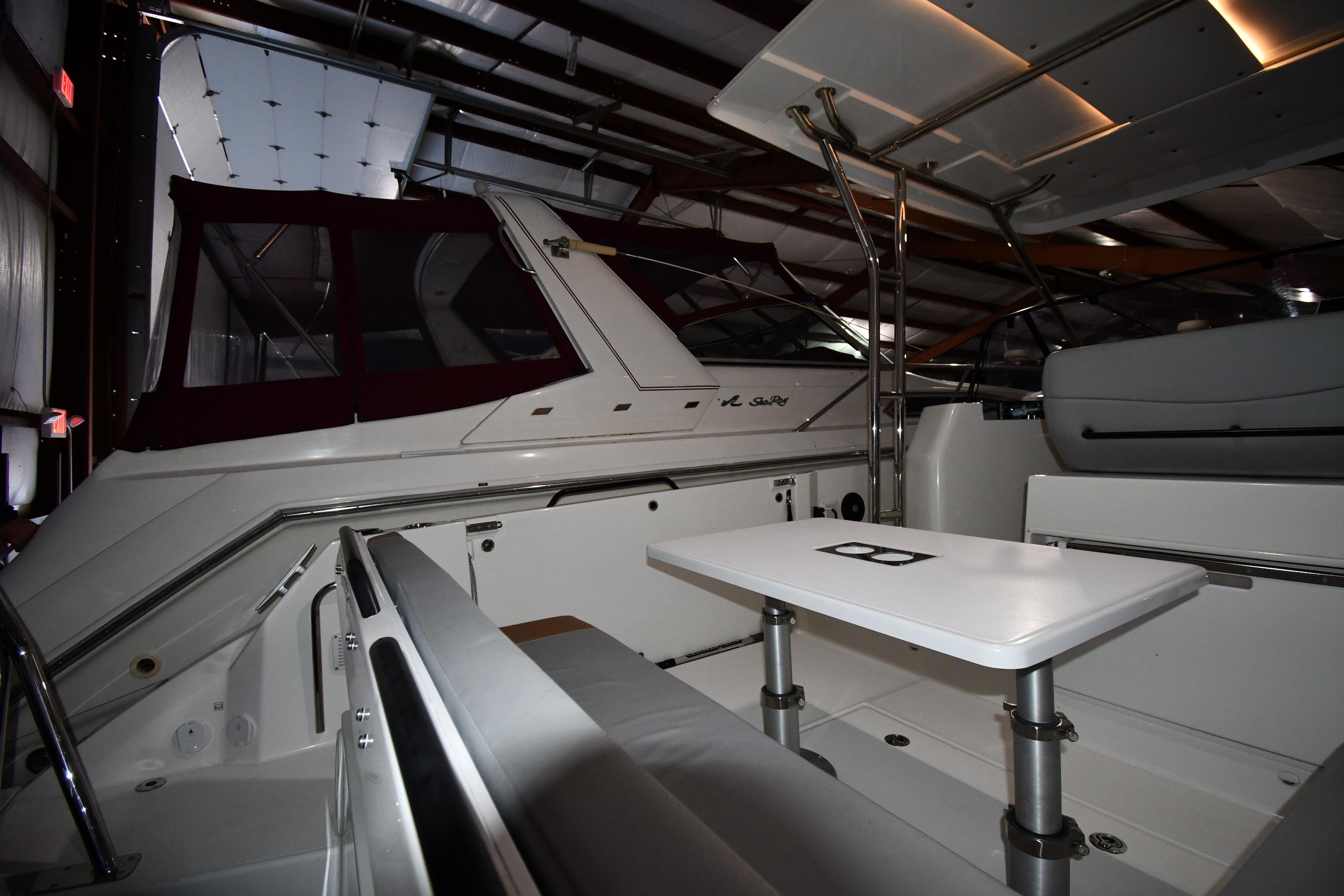 2023 Beneteau Flyer 9 SUNdeck interior, featuring sleek seating and a modern table setup.