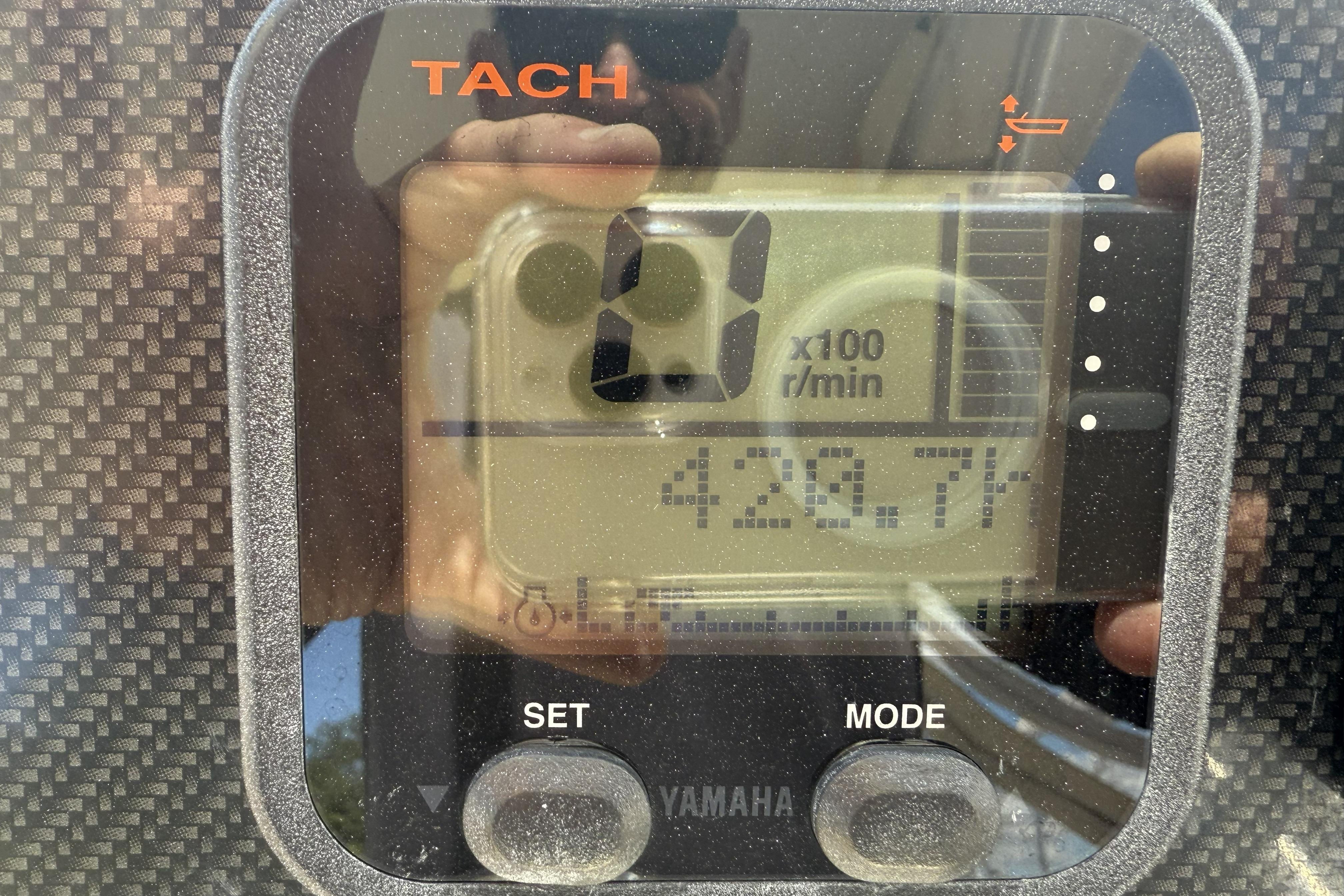 Tachometer display on 2014 Grady-White Freedom 275 boat, showing 420.7 hours.