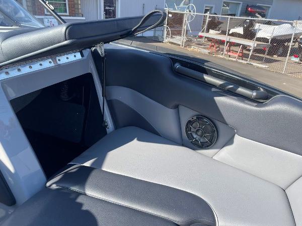 2025 Moomba Mondo boat interior with black and gray seating and speaker detail.
