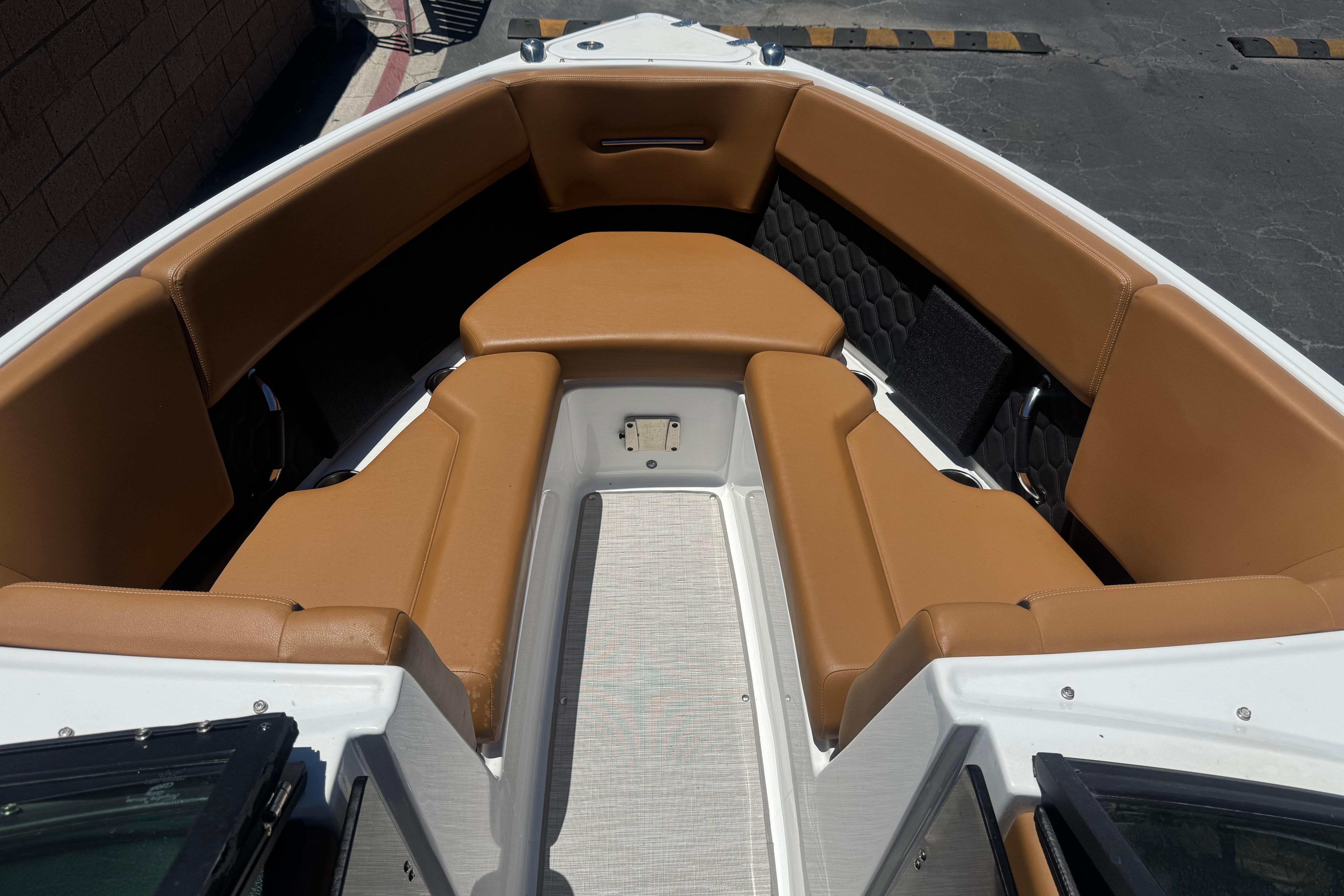 2022 Four Winns H4 boat interior with tan seating and modern design.