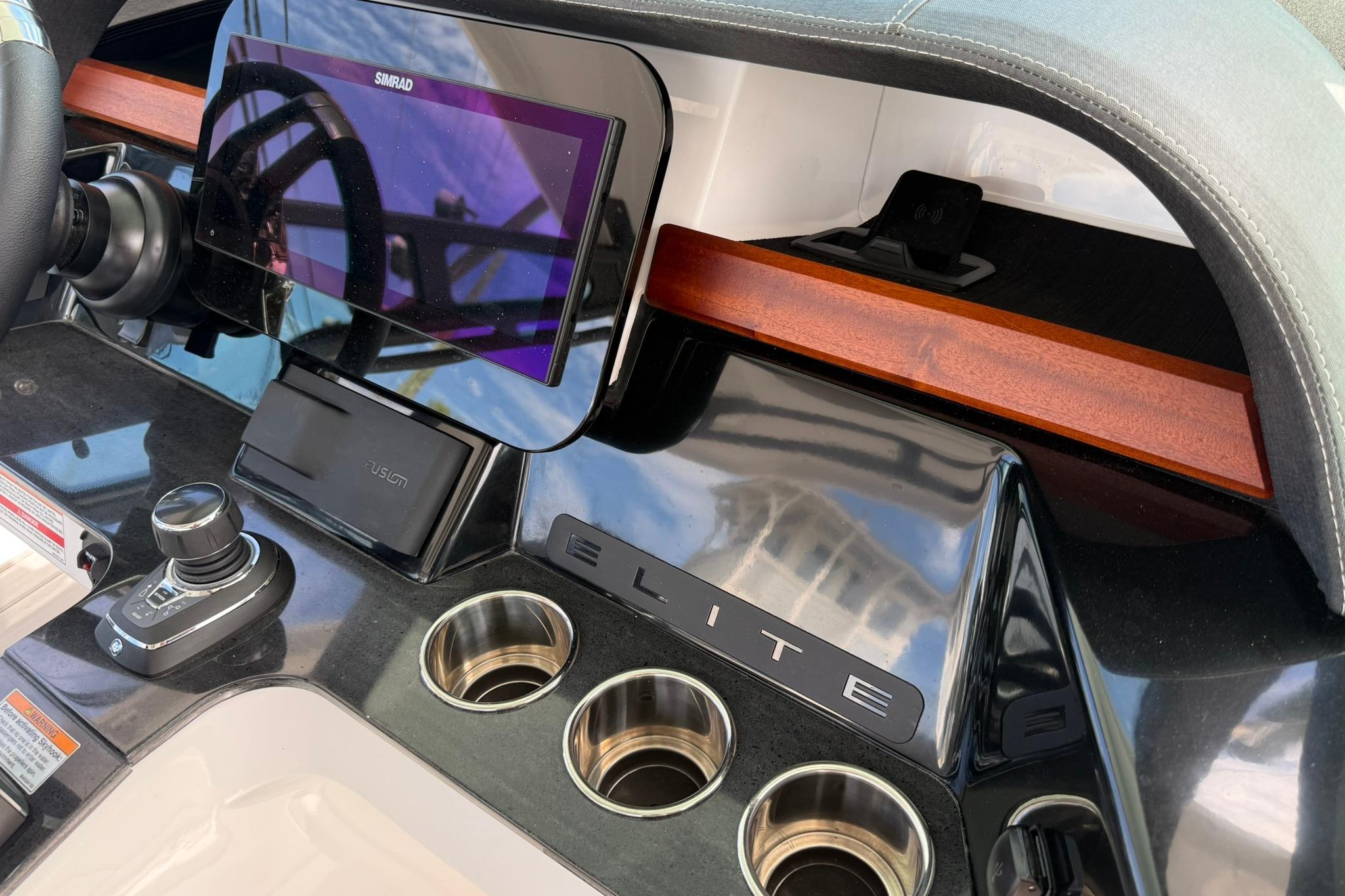 Dashboard of 2027 Monterey Elite 30 OB boat with modern controls and display.