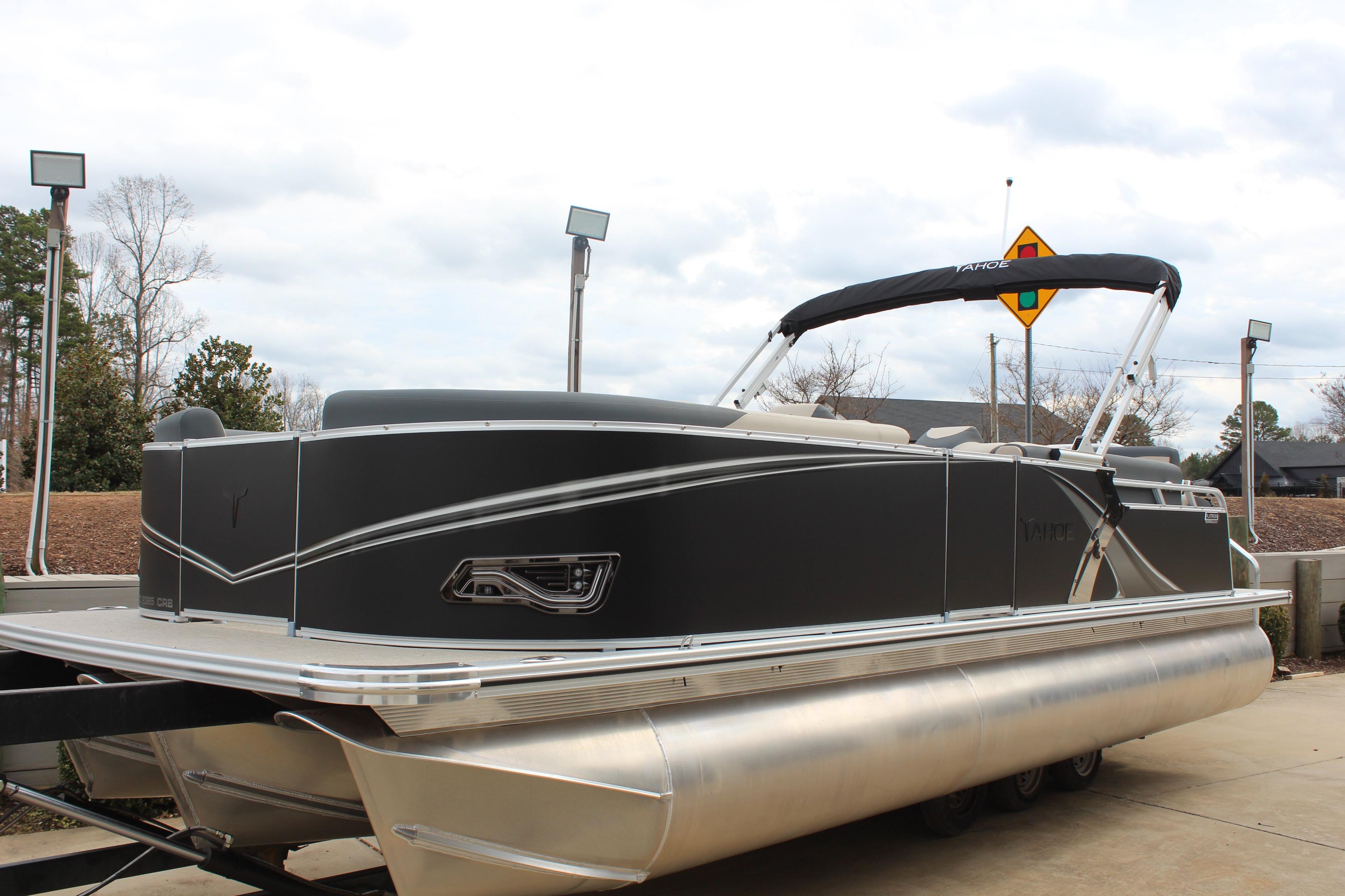 2026 Tahoe Pontoon LTZ boat with sleek design on a trailer.