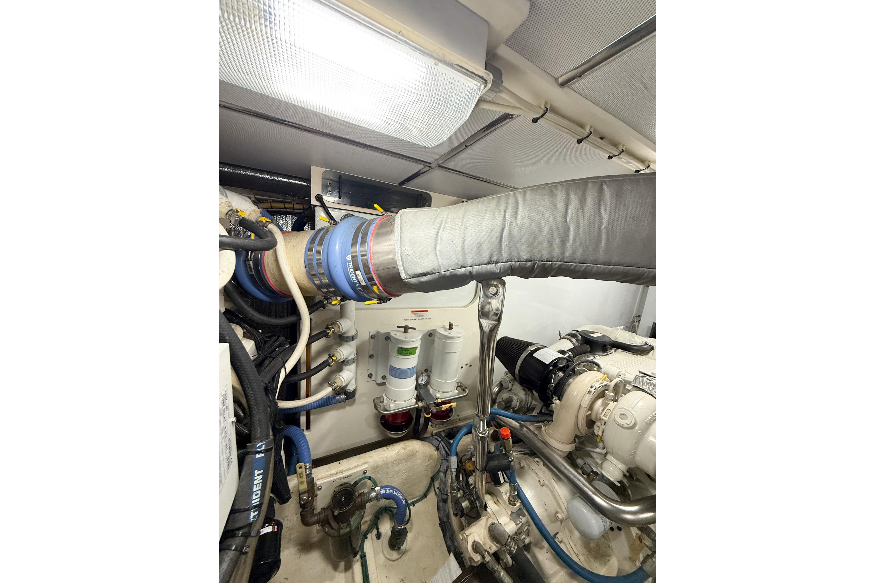 Engine room of a 2007 Nordic Tug 54, showcasing mechanical components and piping.