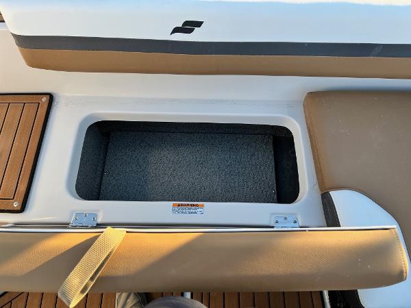 2024 Starcraft SVX 191 boat storage compartment with cushioned seating.
