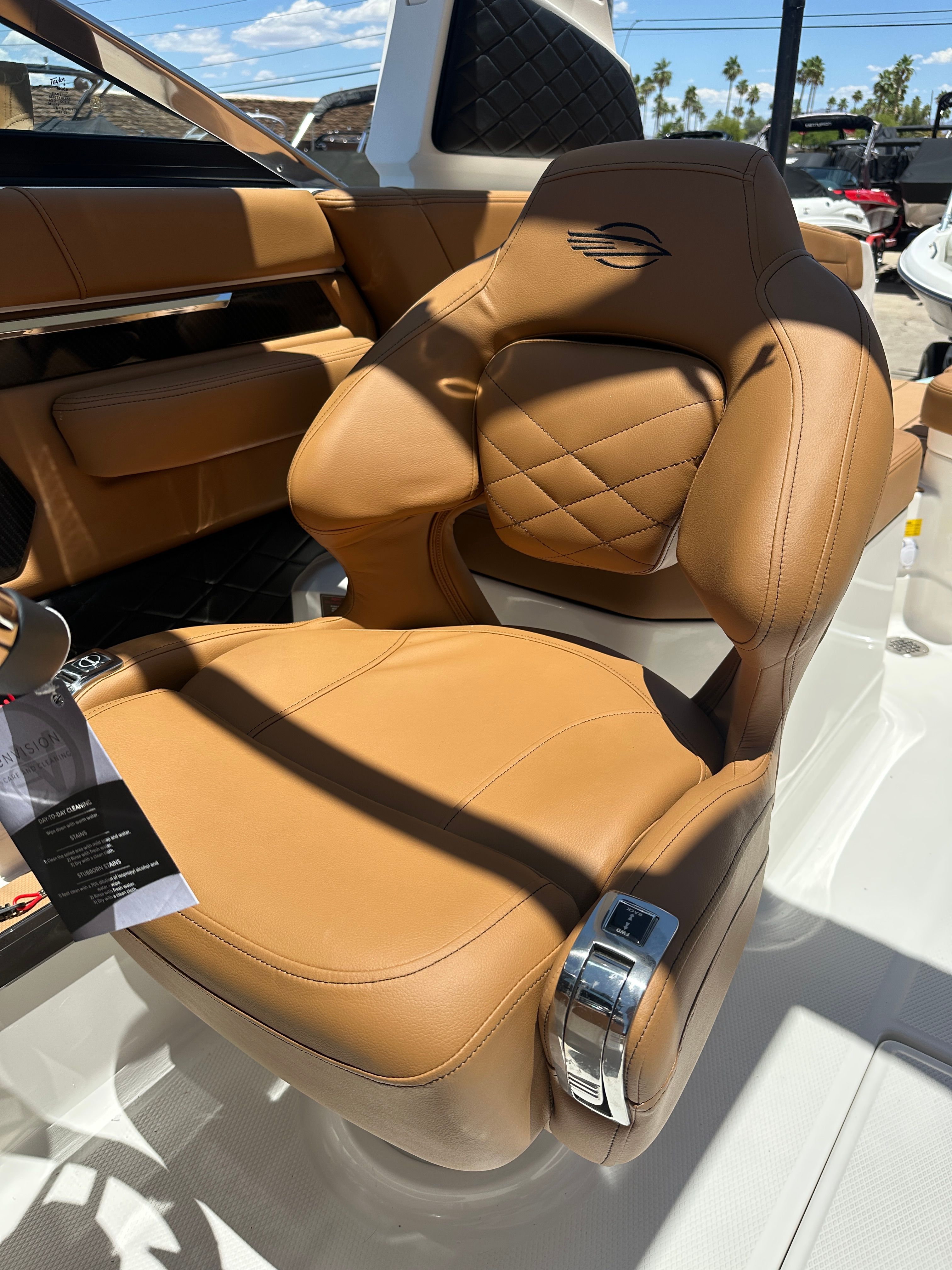 Luxurious leather seat on a Chaparral 26 Surf boat, surrounded by sleek details and modern design.