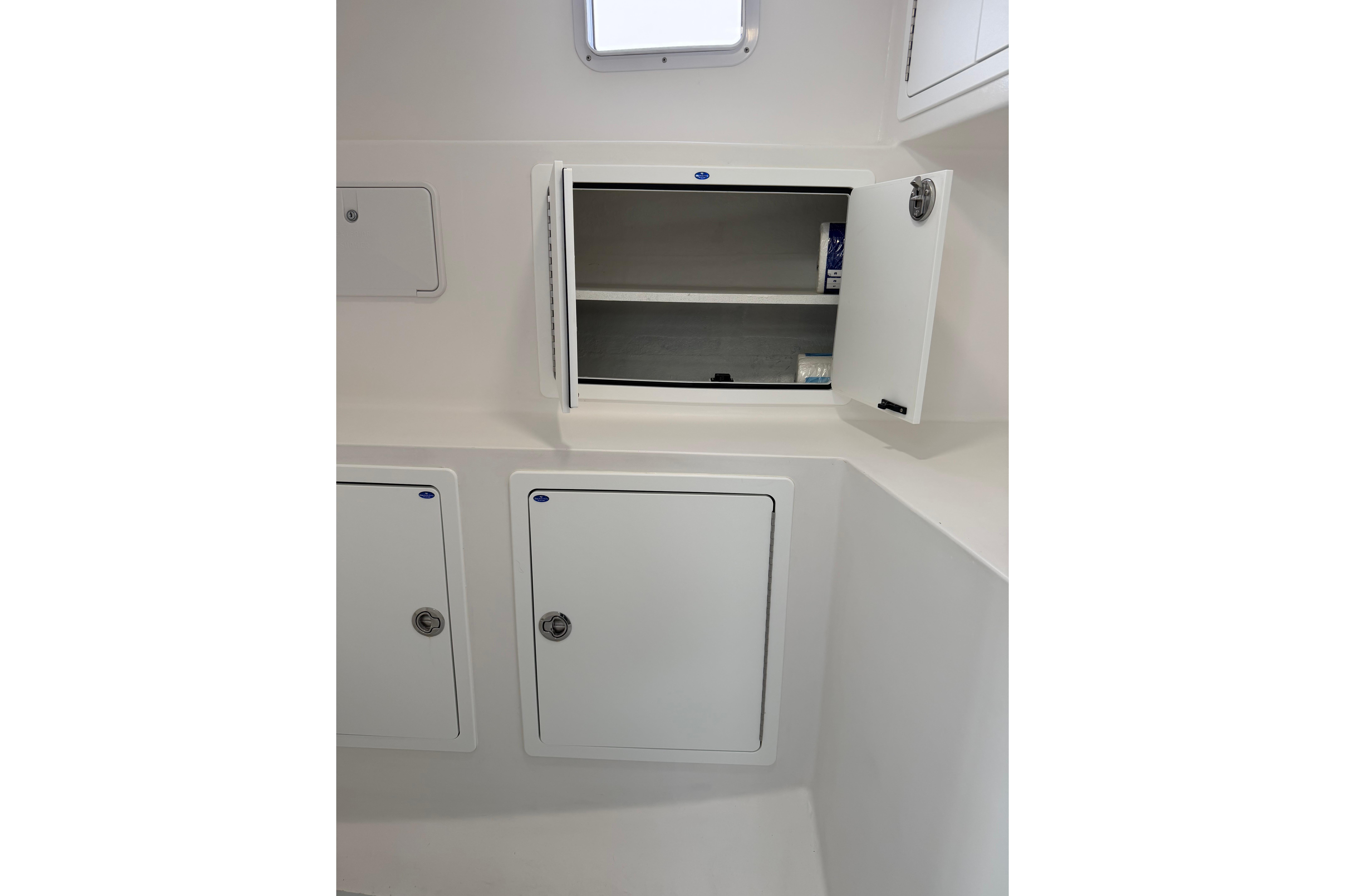 Interior storage compartments on a 2018 H&H Marine Osmond Beal boat.