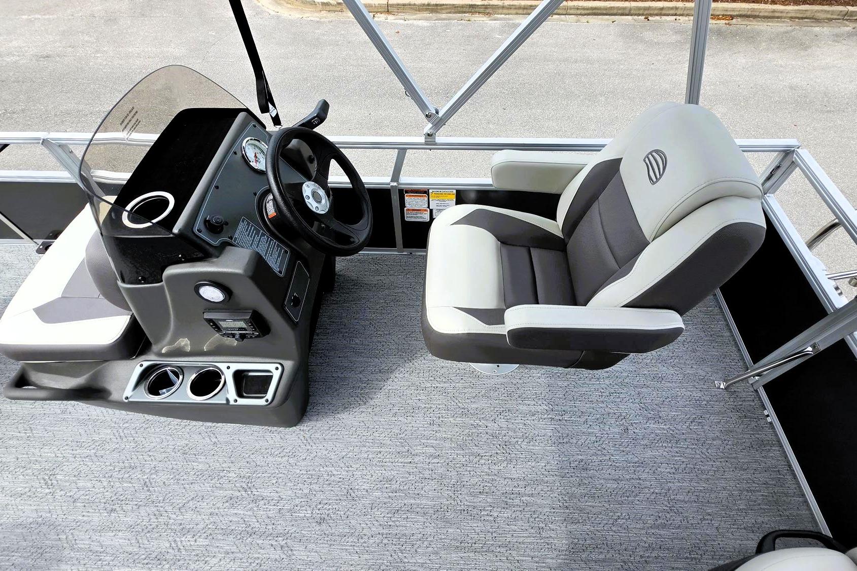 2026 Sun Tracker Bass Buggy 16 XL Select boat interior with steering console and captain's chair.