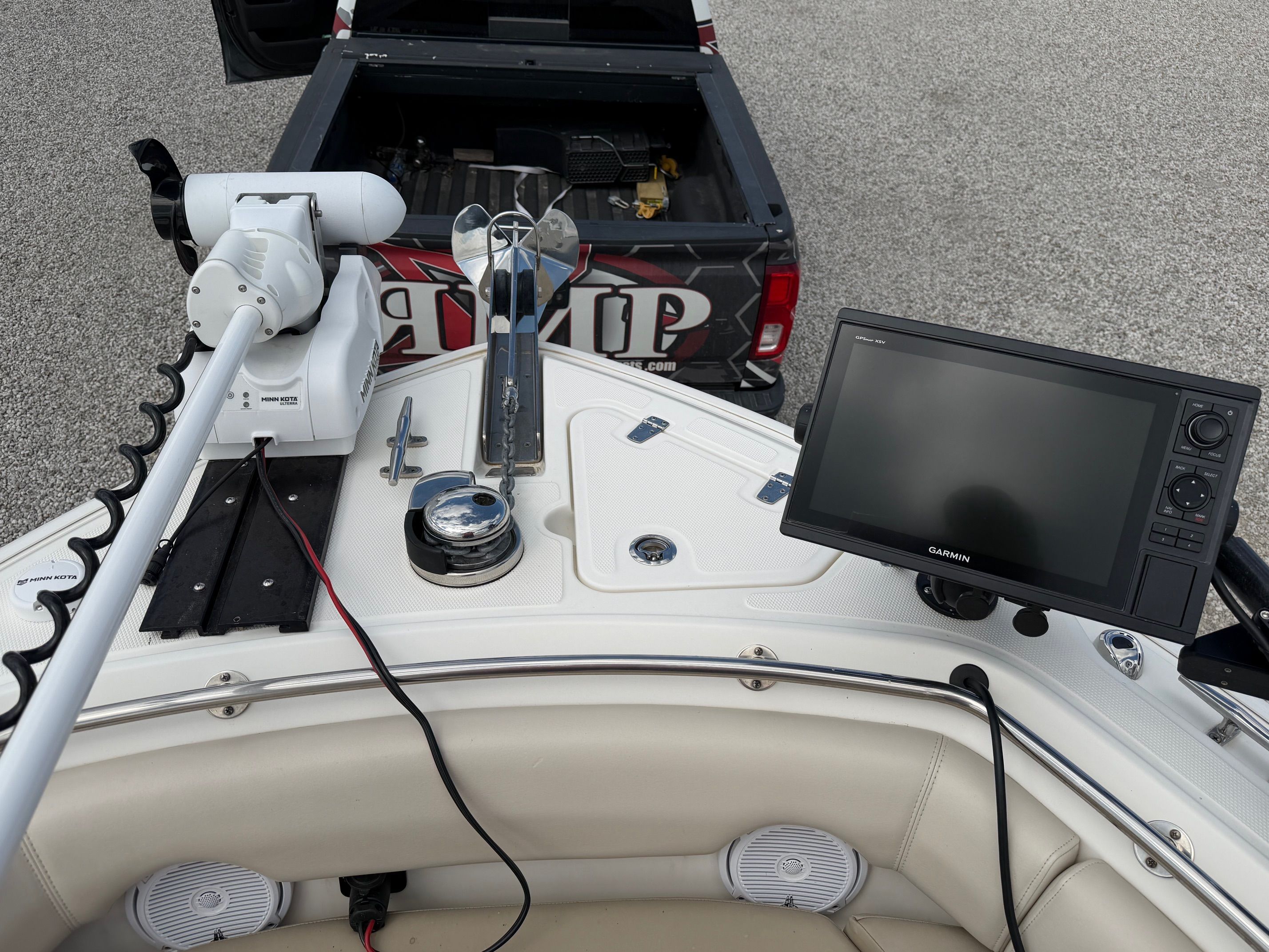 Boston Whaler 230 Outrage 2020 with Garmin display and Minn Kota motor.