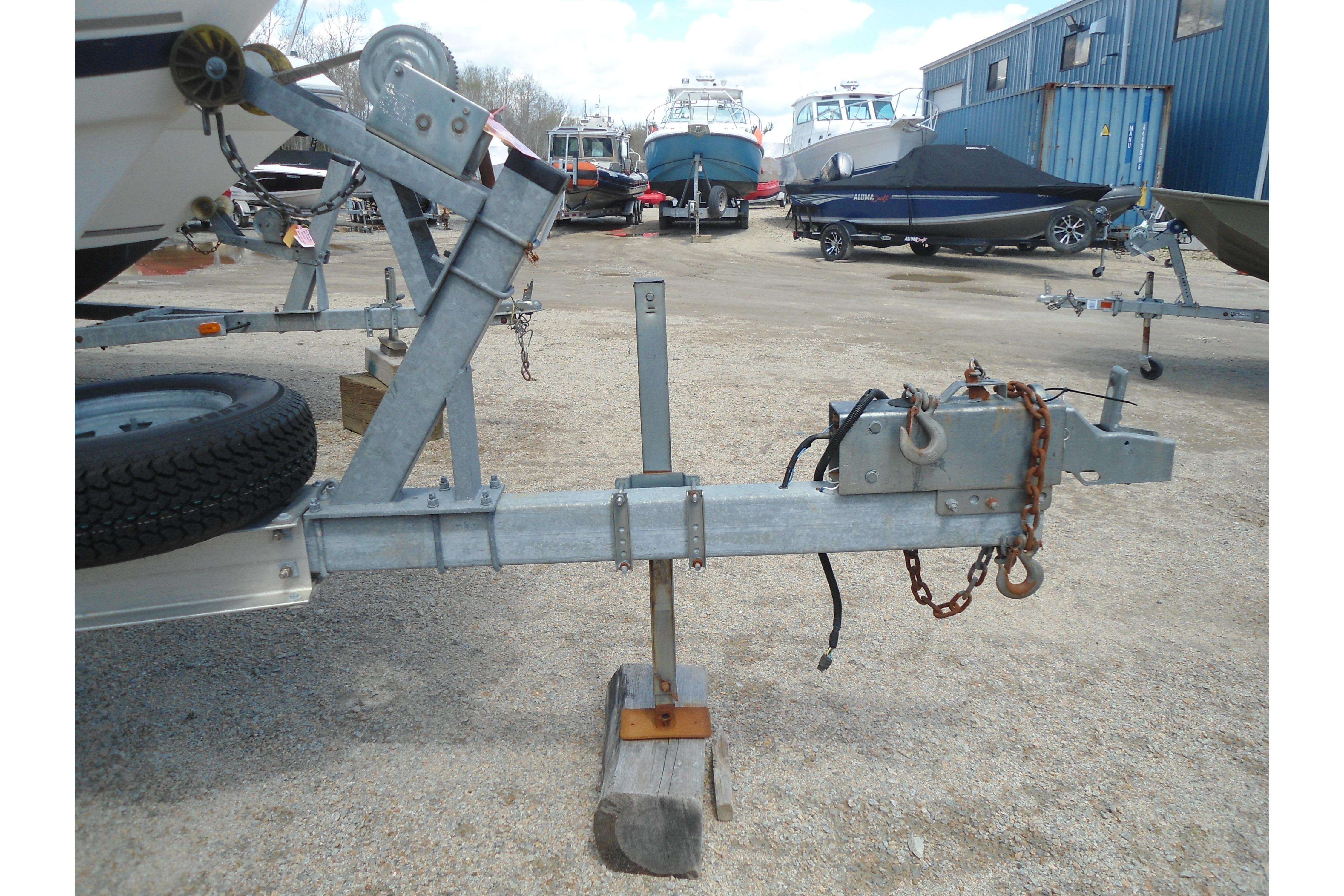 Trailer hitch for 2013 Pursuit C 260 Center Console boat in a boatyard.