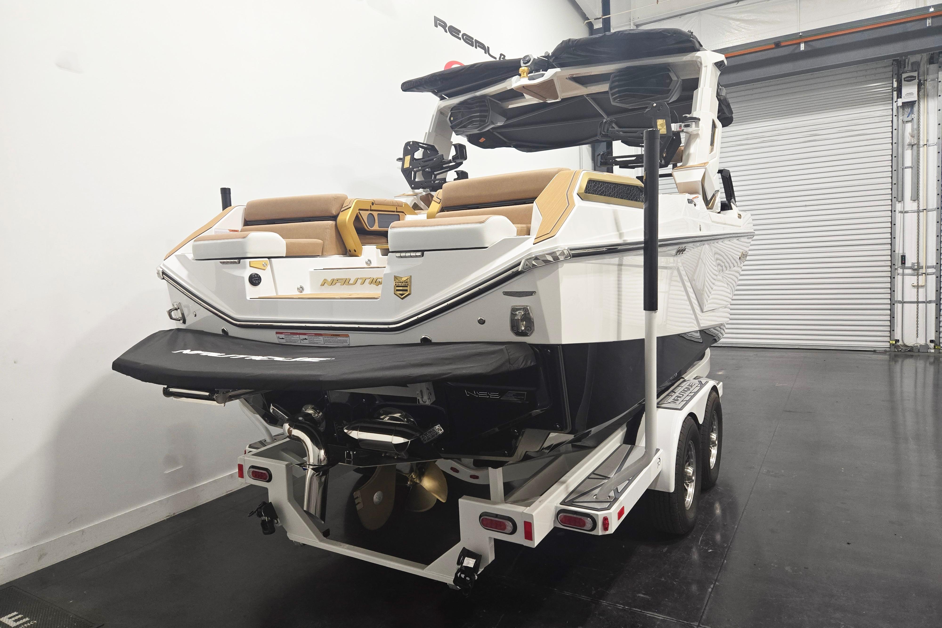 2026 Nautique Super Air Nautique G23 Paragon boat on trailer in garage.