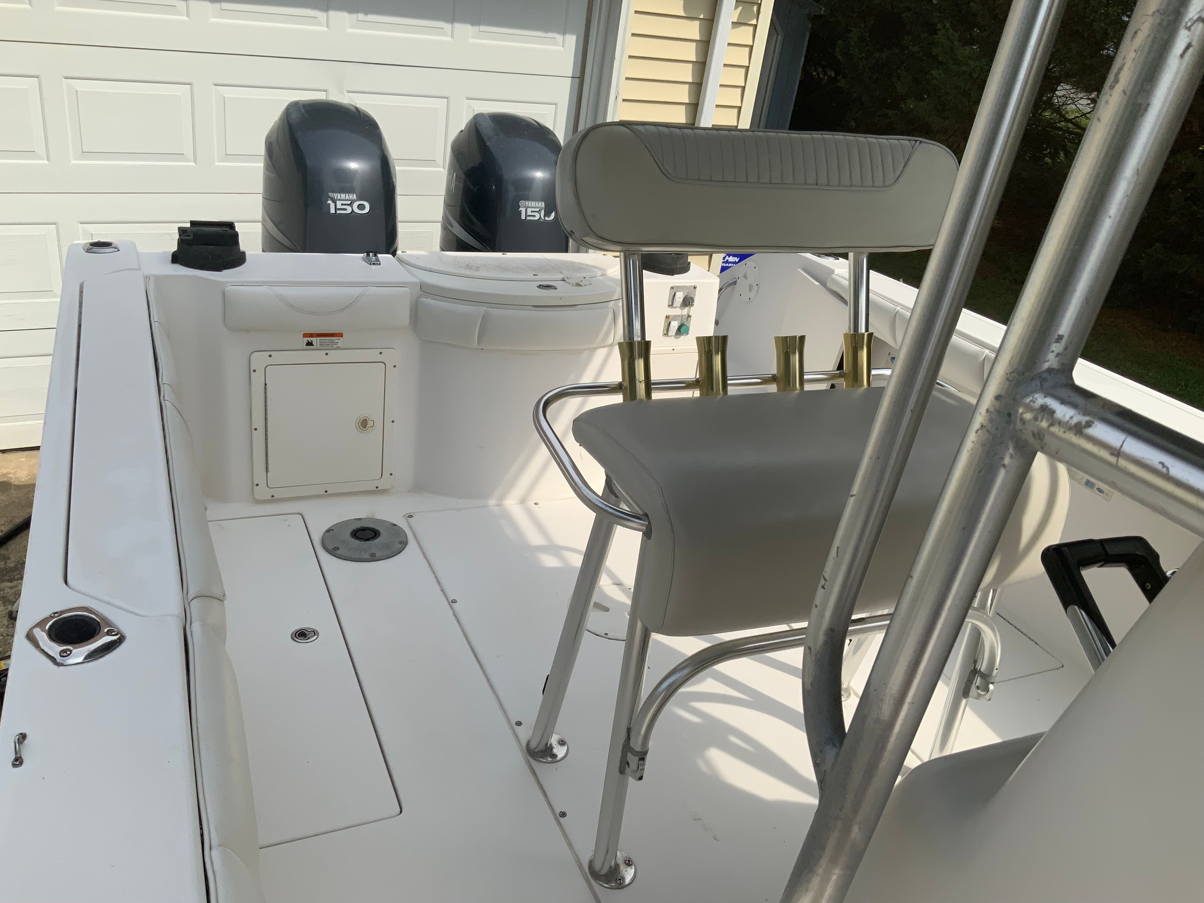 The image shows the cockpit of a 2006 Seaswirl Striper 26 with two outboard engines.
