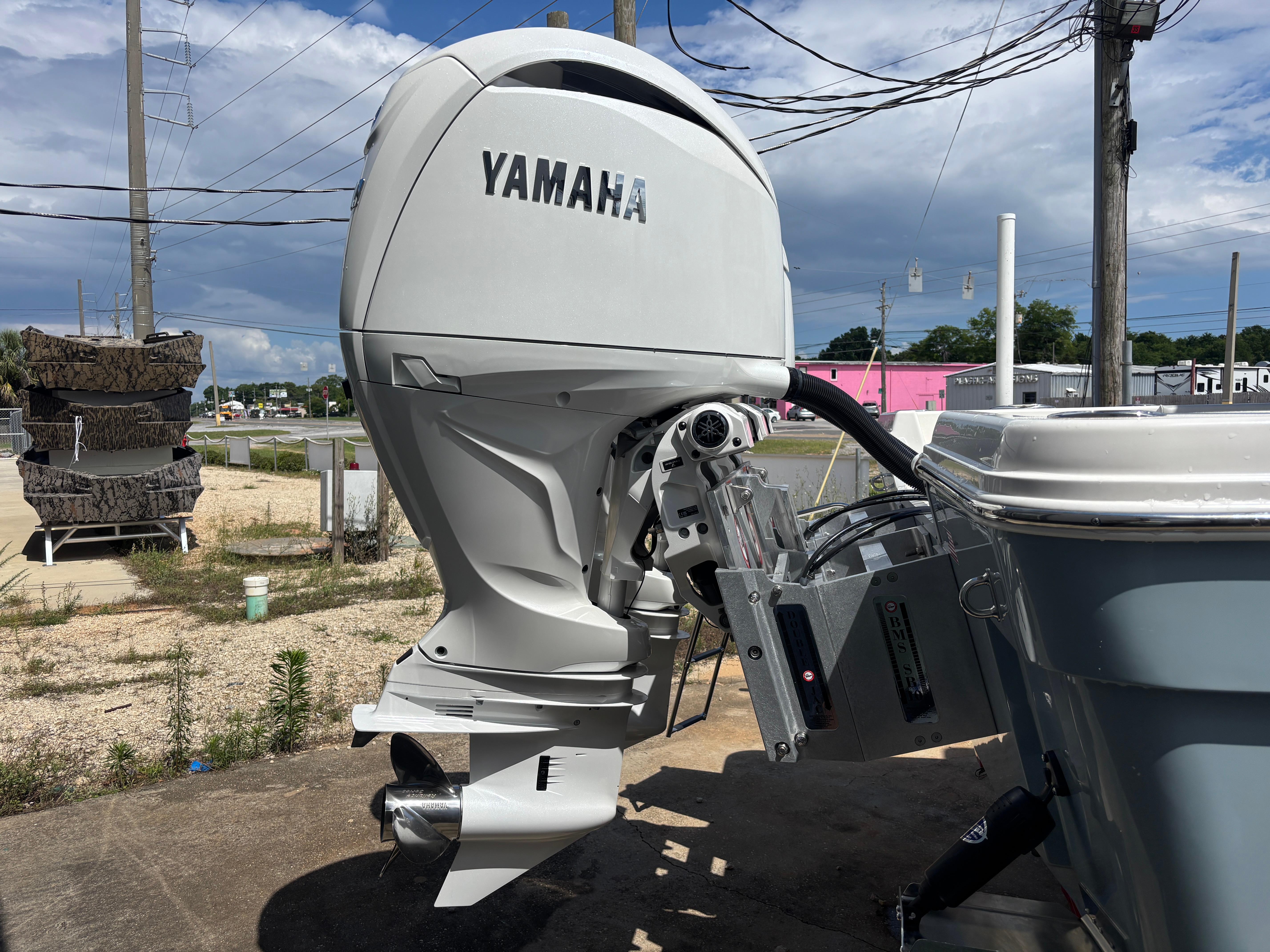 2025 KenCraft 269 boat with sleek design and spacious interior, featuring a sunshade canopy.