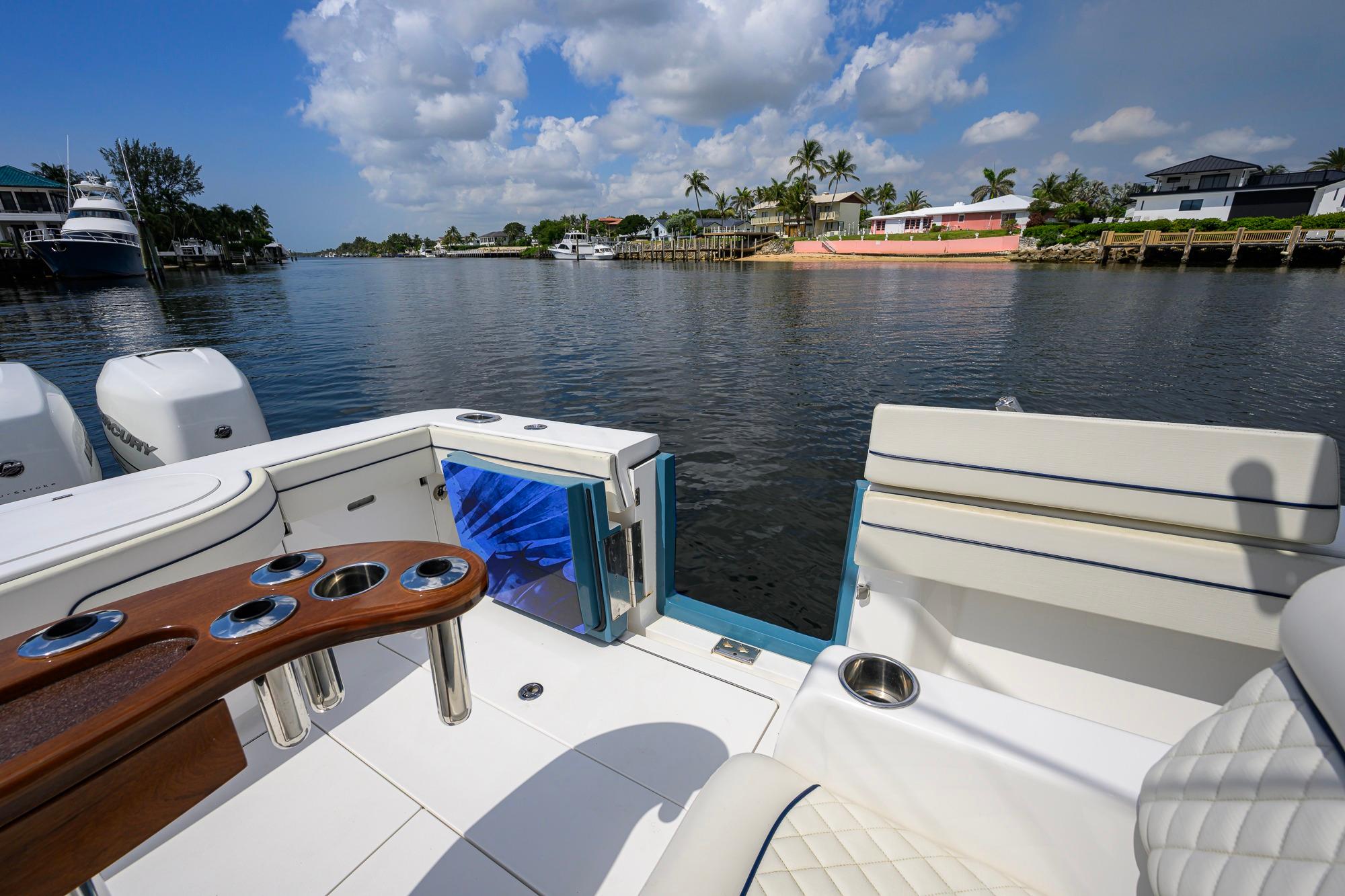 2020 Valhalla Boatworks V-41 on calm water, featuring luxurious seating and fishing amenities.