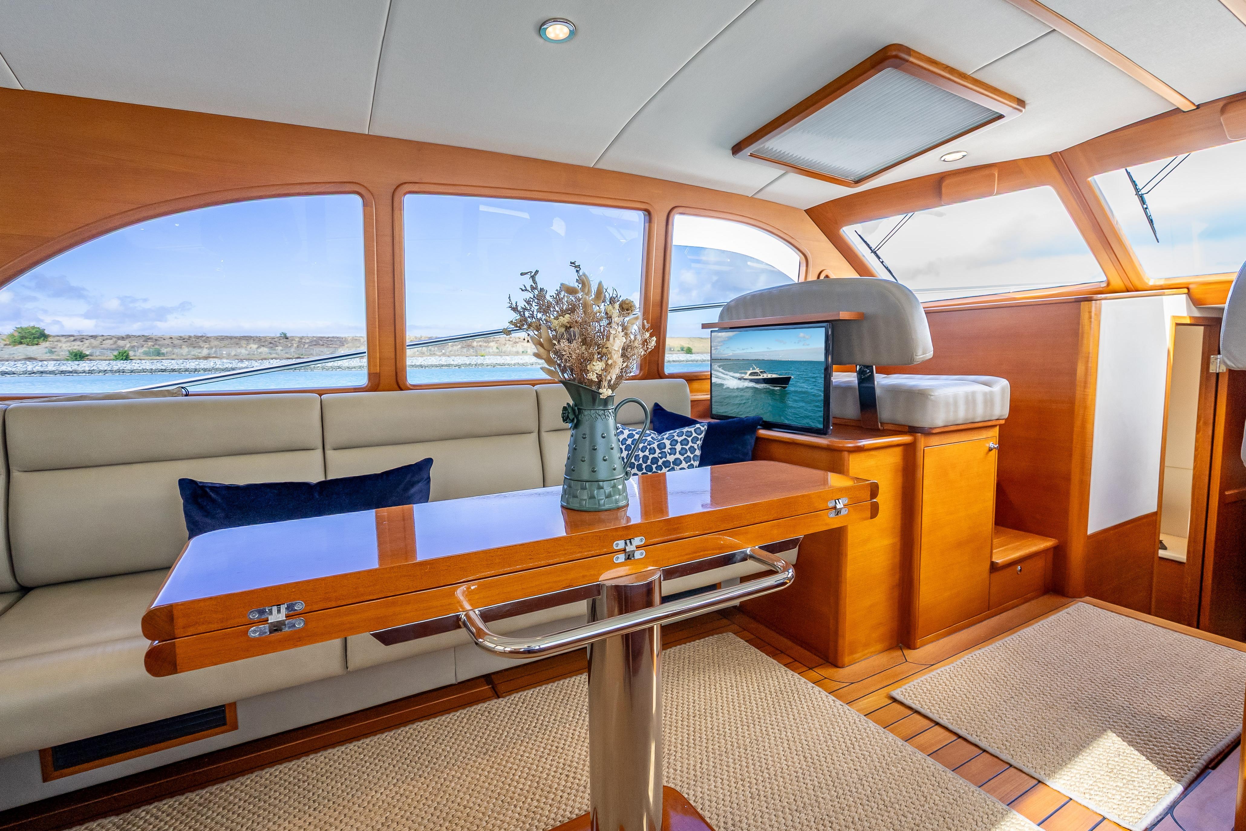 Luxurious interior of 2018 Palm Beach Motor Yachts PB50 with elegant wood finishes.
