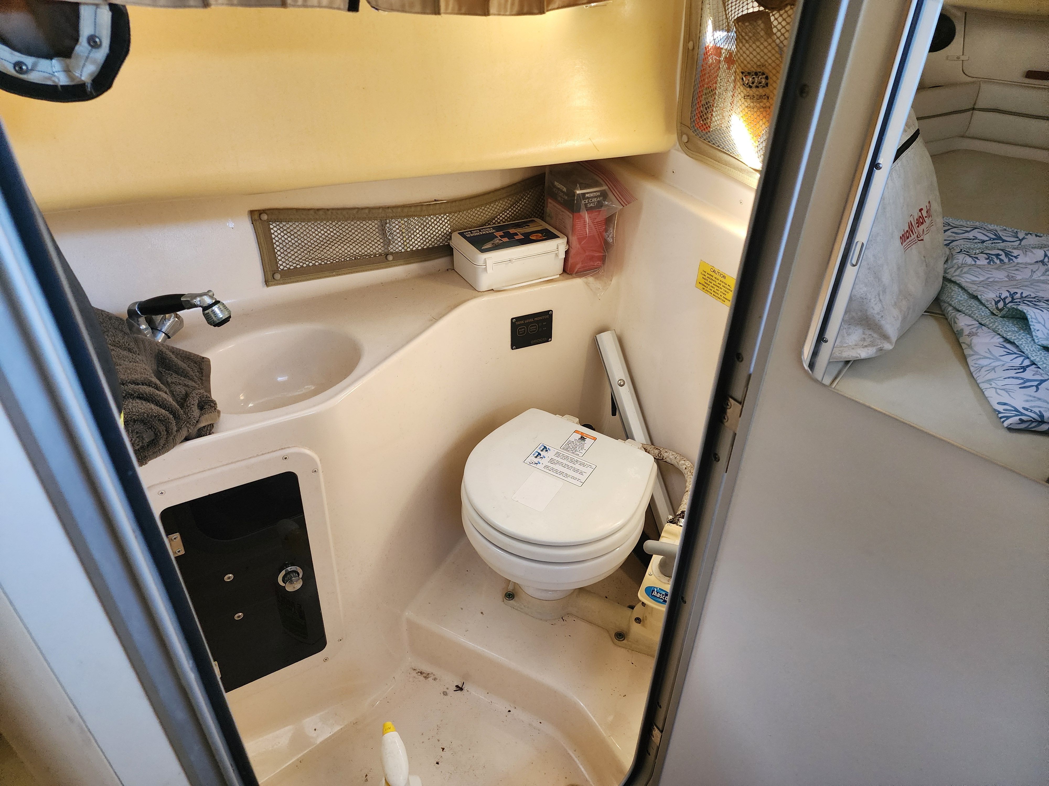 Interior of 2005 Grady-White Sailfish 282 with toilet and sink.