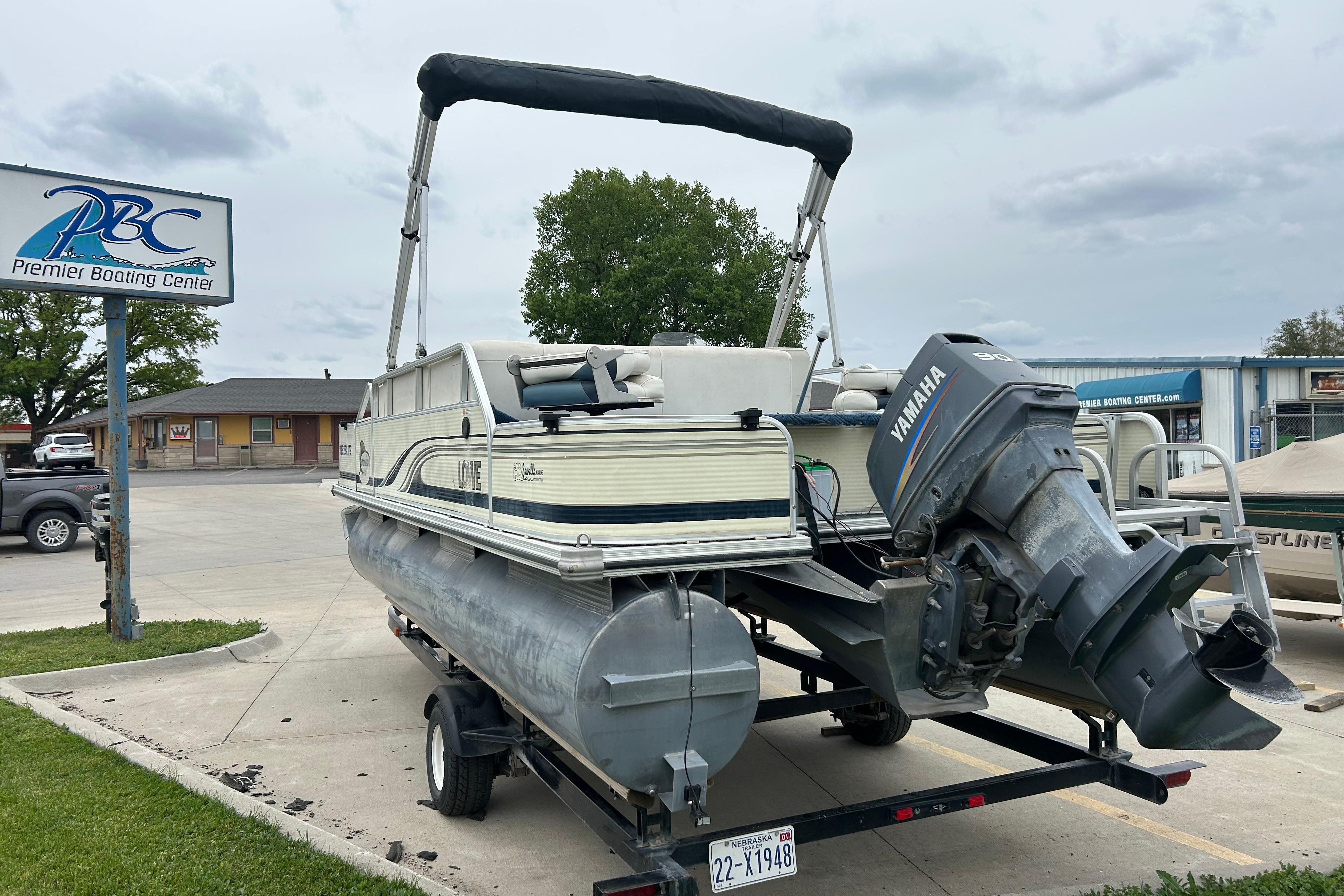 2002 Lowe Trinidad 200 pontoon boat with Yamaha motor at Premier Boating Center.