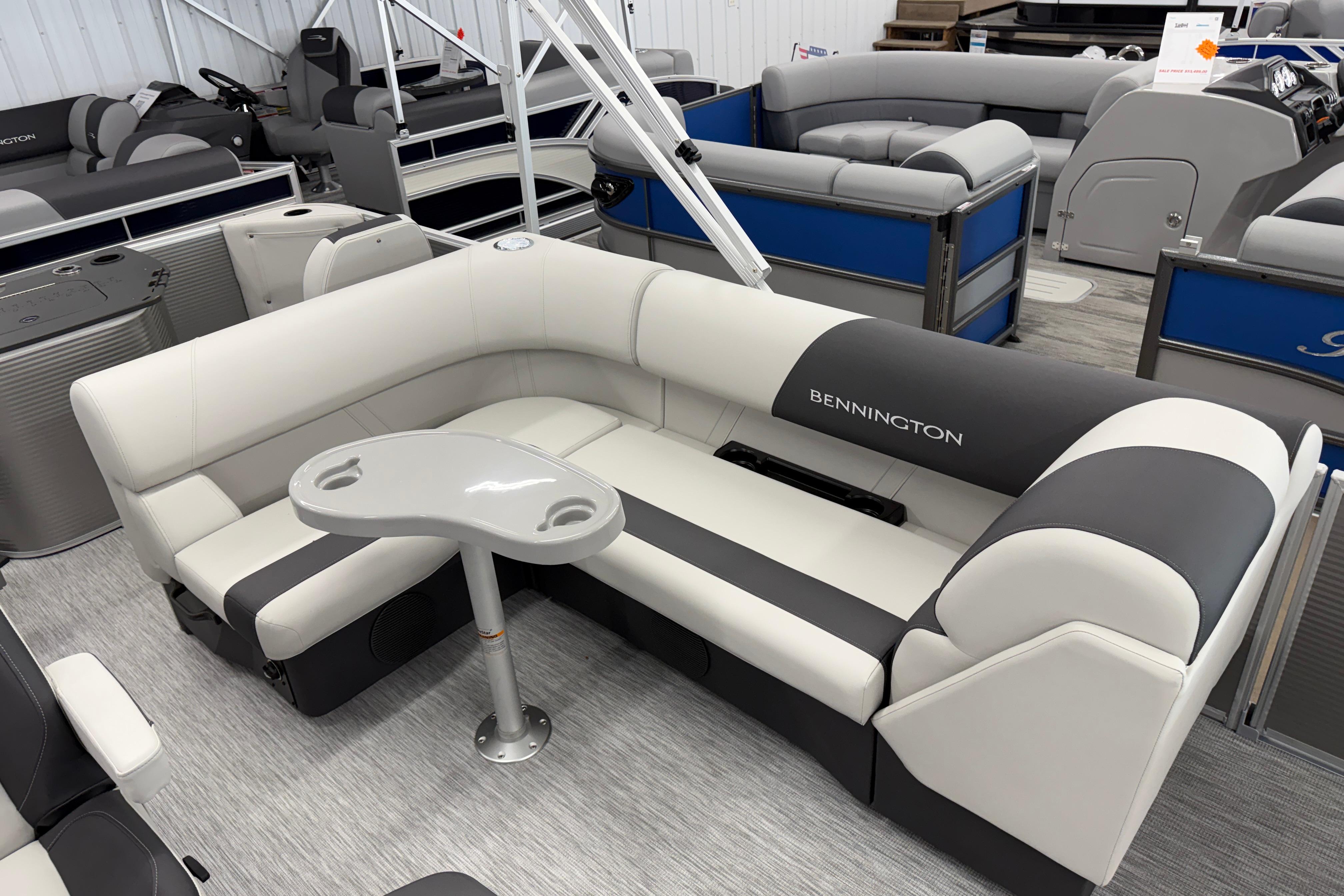 2026 Bennington 20 SF pontoon boat interior with gray and white seating.