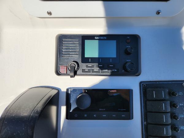 Garmin and Fusion marine electronics on 2023 May-Craft 208 CC boat dashboard.