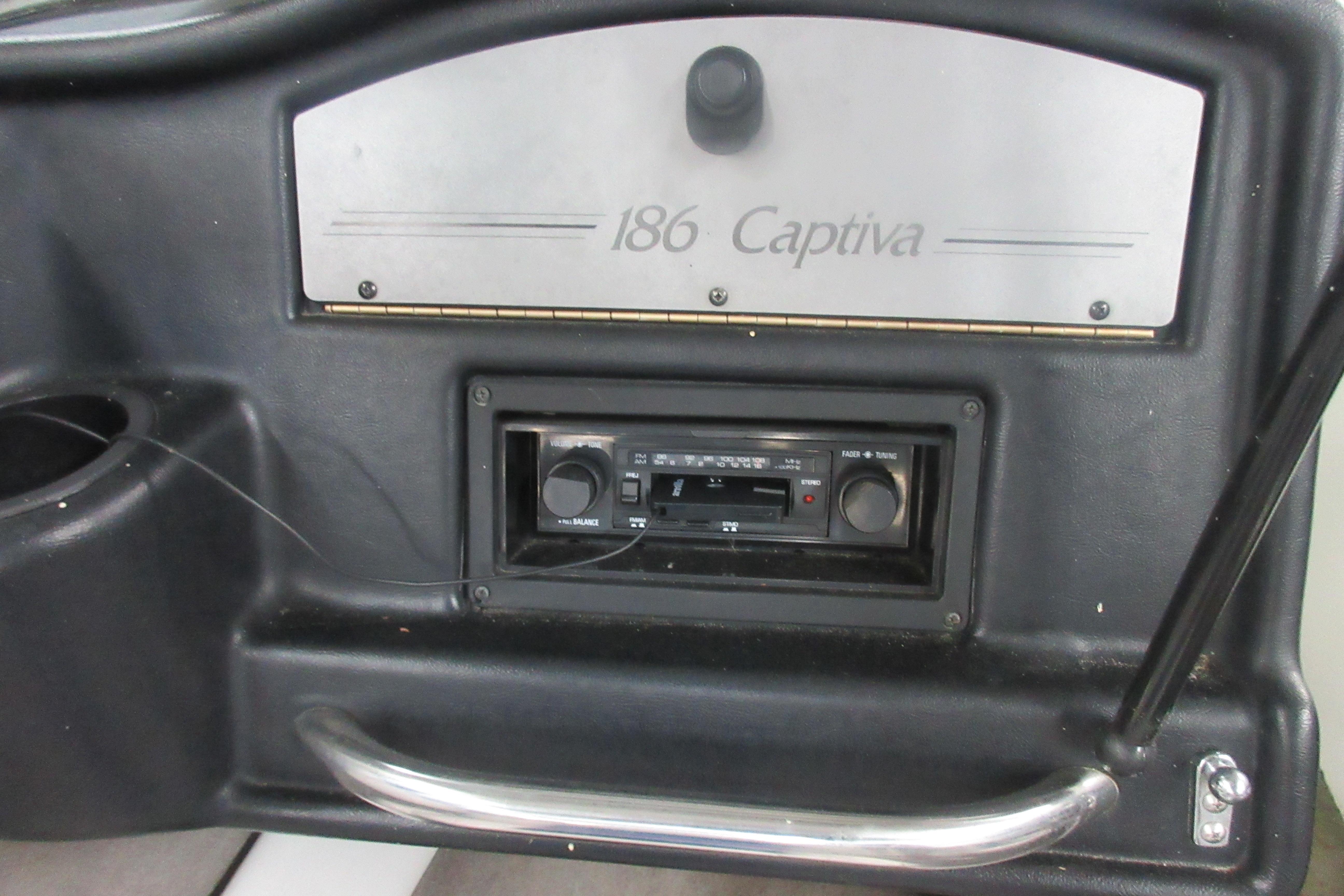 1993 Rinker 186 Captiva Bowrider dashboard with stereo system and control panel.