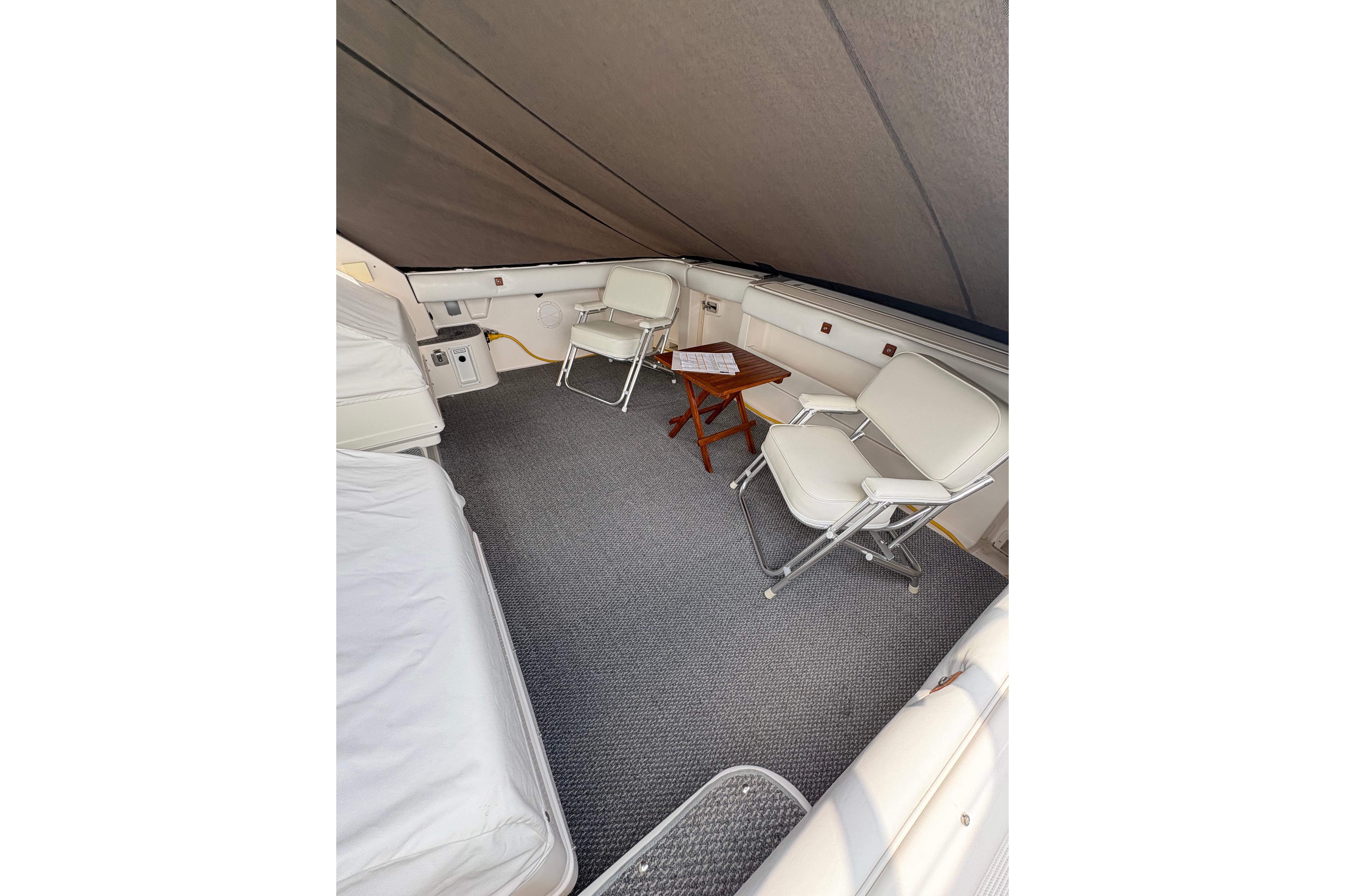 Interior of 1999 Tiara Yachts 3100 Open with seating and table.