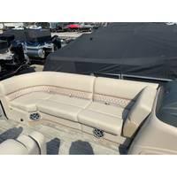 2025 Ranger Reata 223FC boat interior with beige seating and speaker system.
