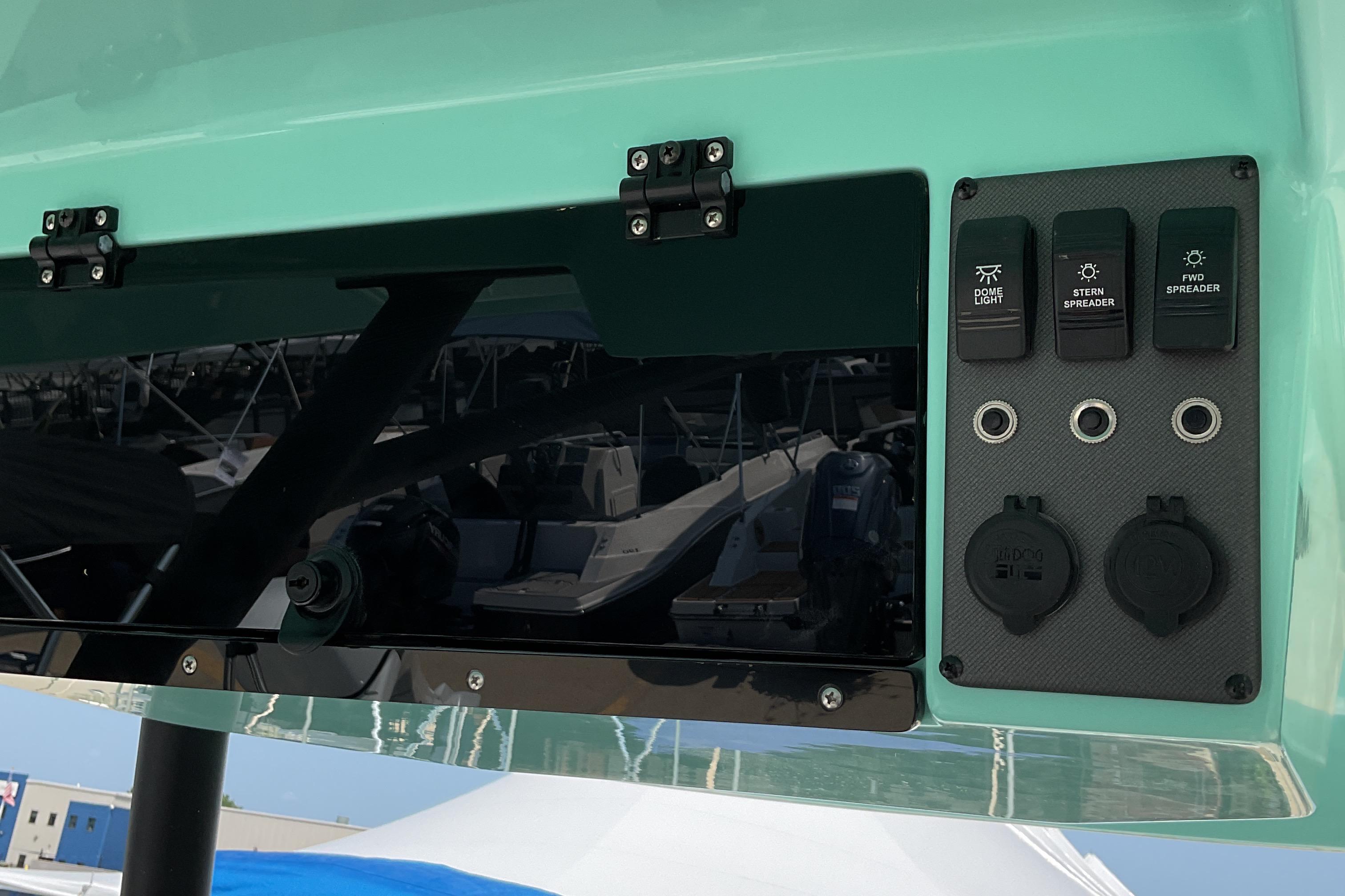 2026 Starcraft SVX 231 OB CC boat control panel with switches and outlets.