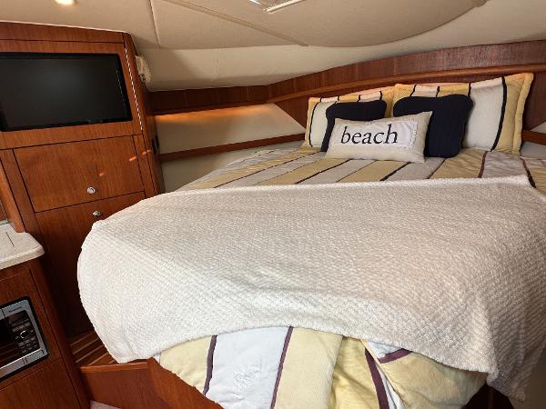 2006 Tiara Yachts 3200 Open cabin with cozy bed and TV.